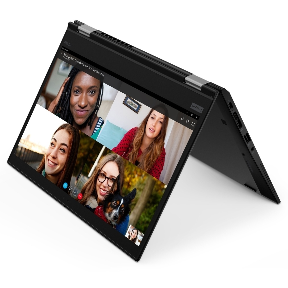 Un ordinateur portable Lenovo Yoga noir ouvert affiche un appel vidéo avec quatre personnes.
