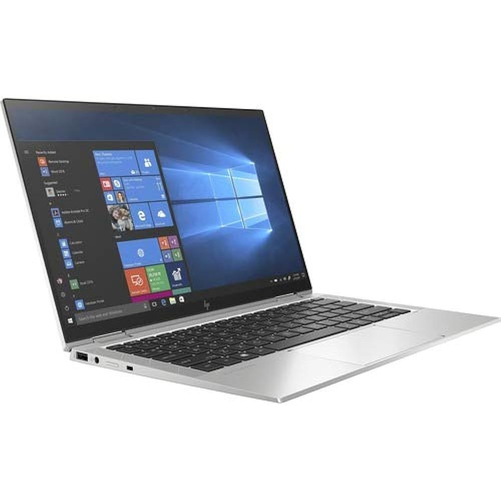 Een open zilveren laptop met een Windows startscherm en toetsenbord.