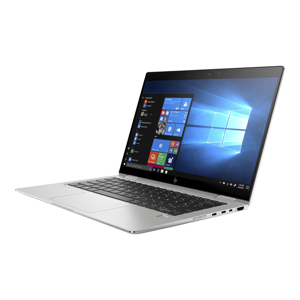 Un ordinateur portable argenté avec écran ouvert, affichant des applications Windows.