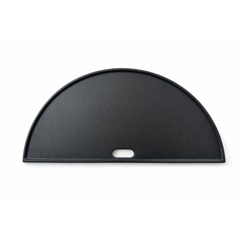 A black, semi-circular cast iron griddle with a handle hole.