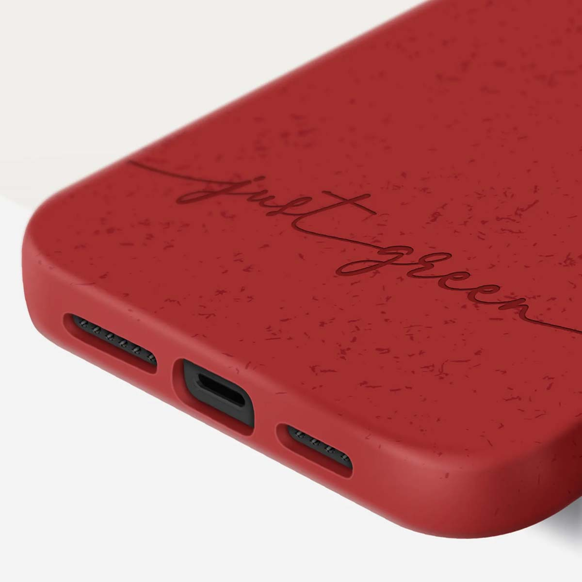 Custodia rossa per telefono con la scritta "Just Green".