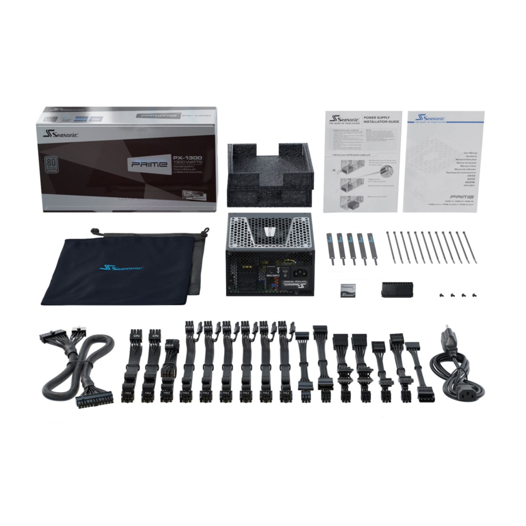 Zasilacz Seasonic, kable, instrukcja i akcesoria na białym tle.