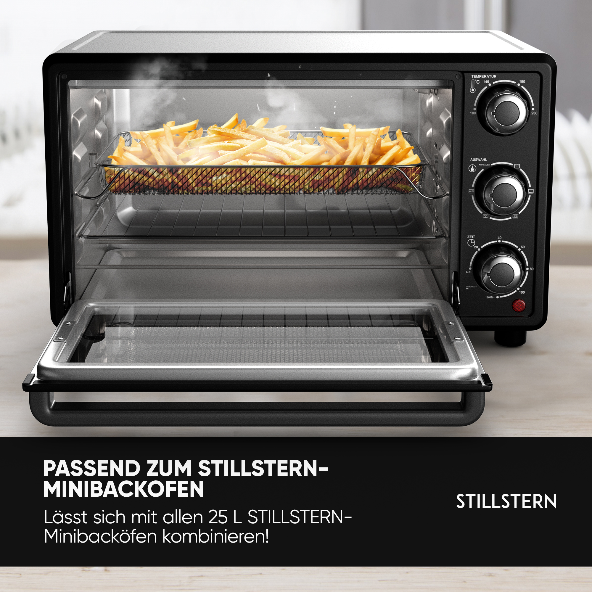 Ein schwarzer Minibackofen mit einem Rost Pommes frites und Dampf.