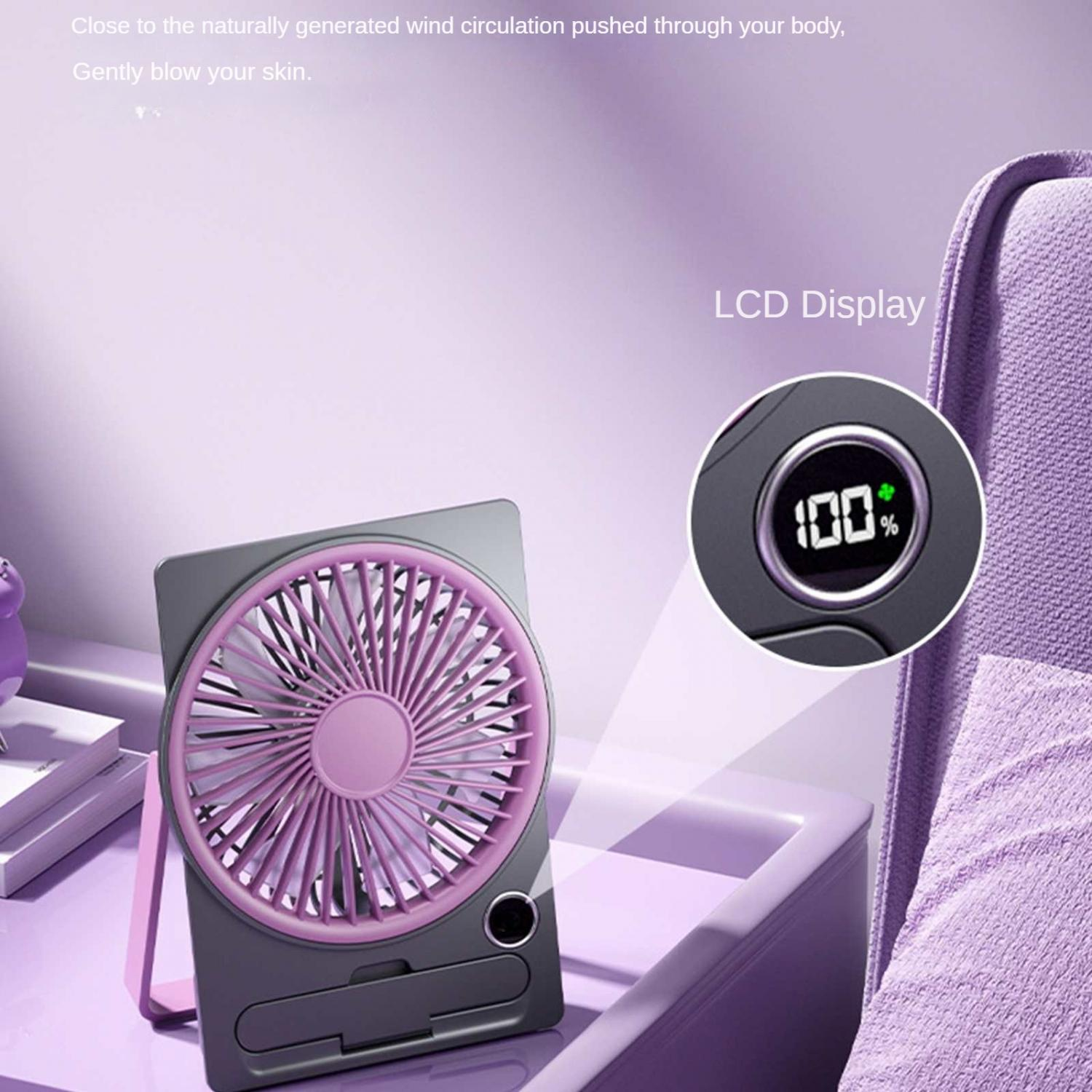 Ein grauer und pinker Ventilator steht auf einem Schreibtisch mit einem LCD-Display, das 100% anzeigt.