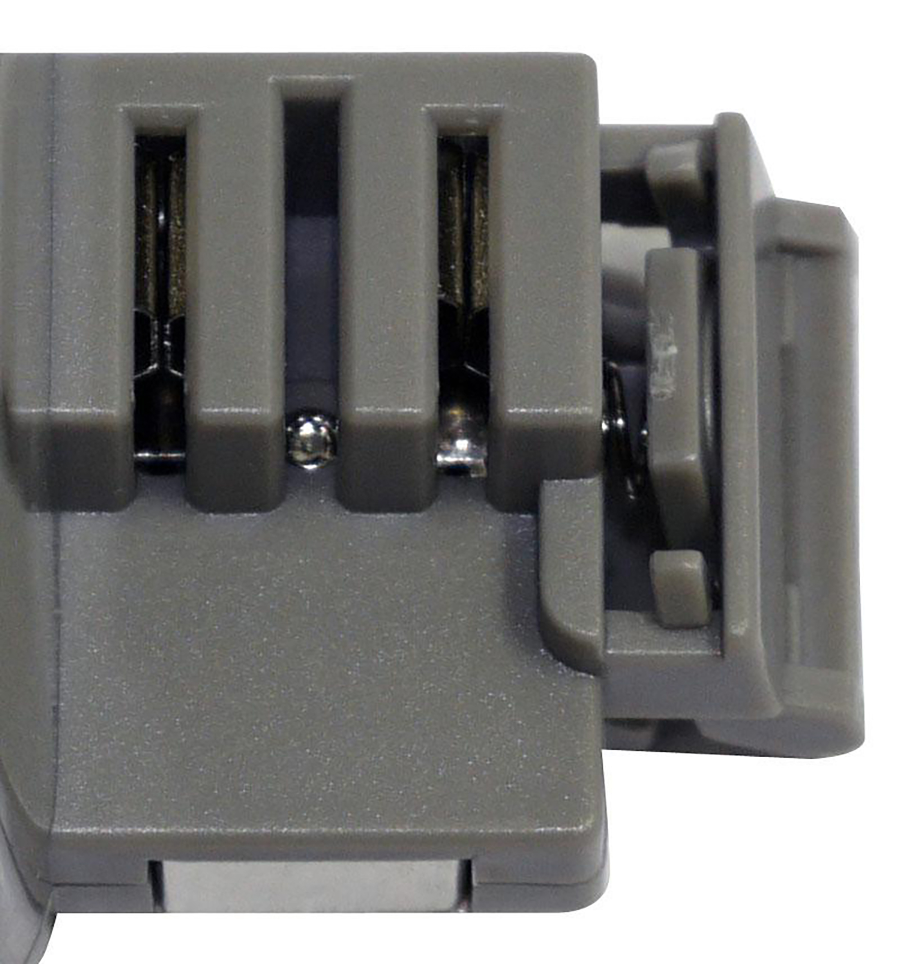 Grauer Plastikstecker mit zwei Schlitzen und Metallkontakten.