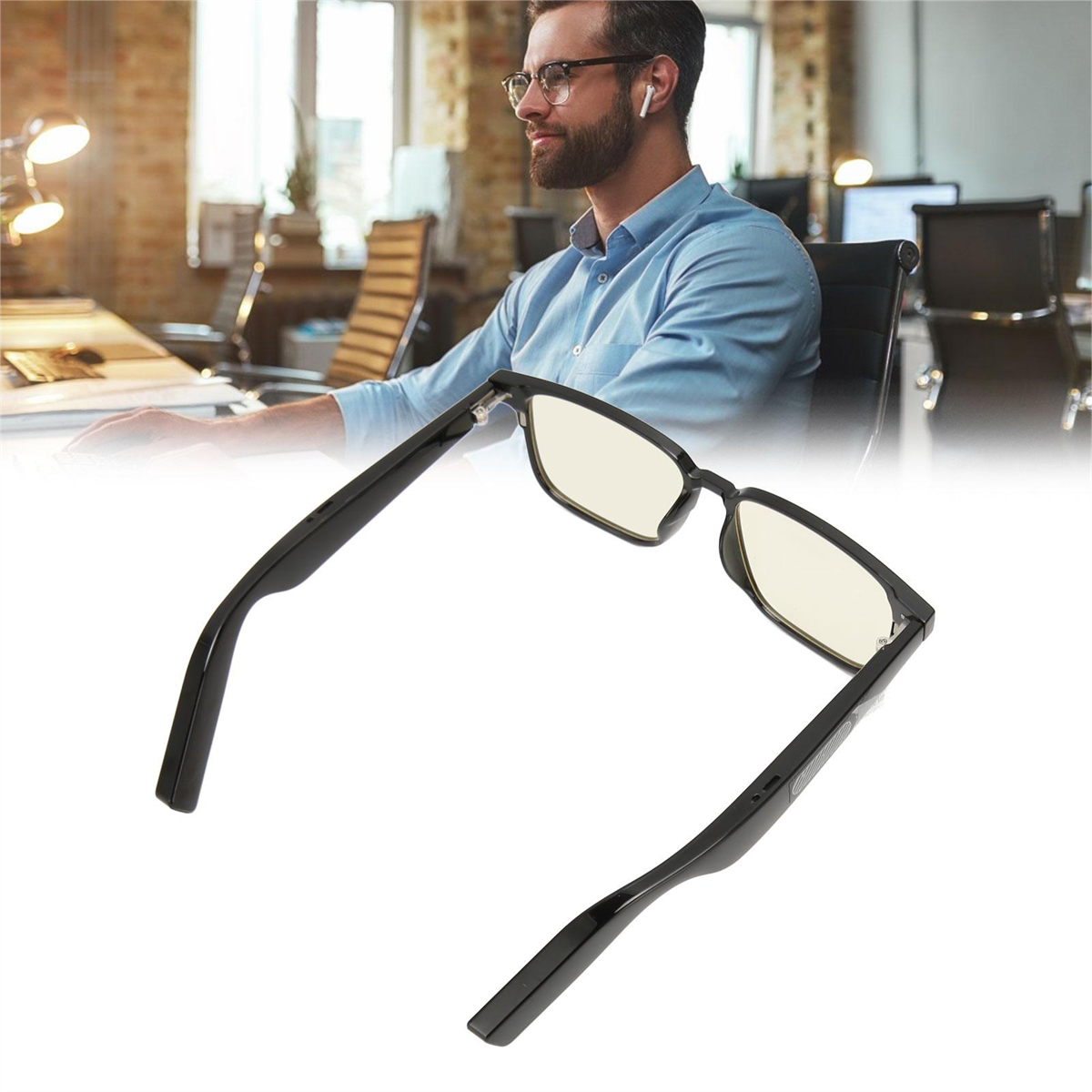 Schwarze Brille mit gelben Gläsern im Vordergrund, Mann im Büro im Hintergrund.