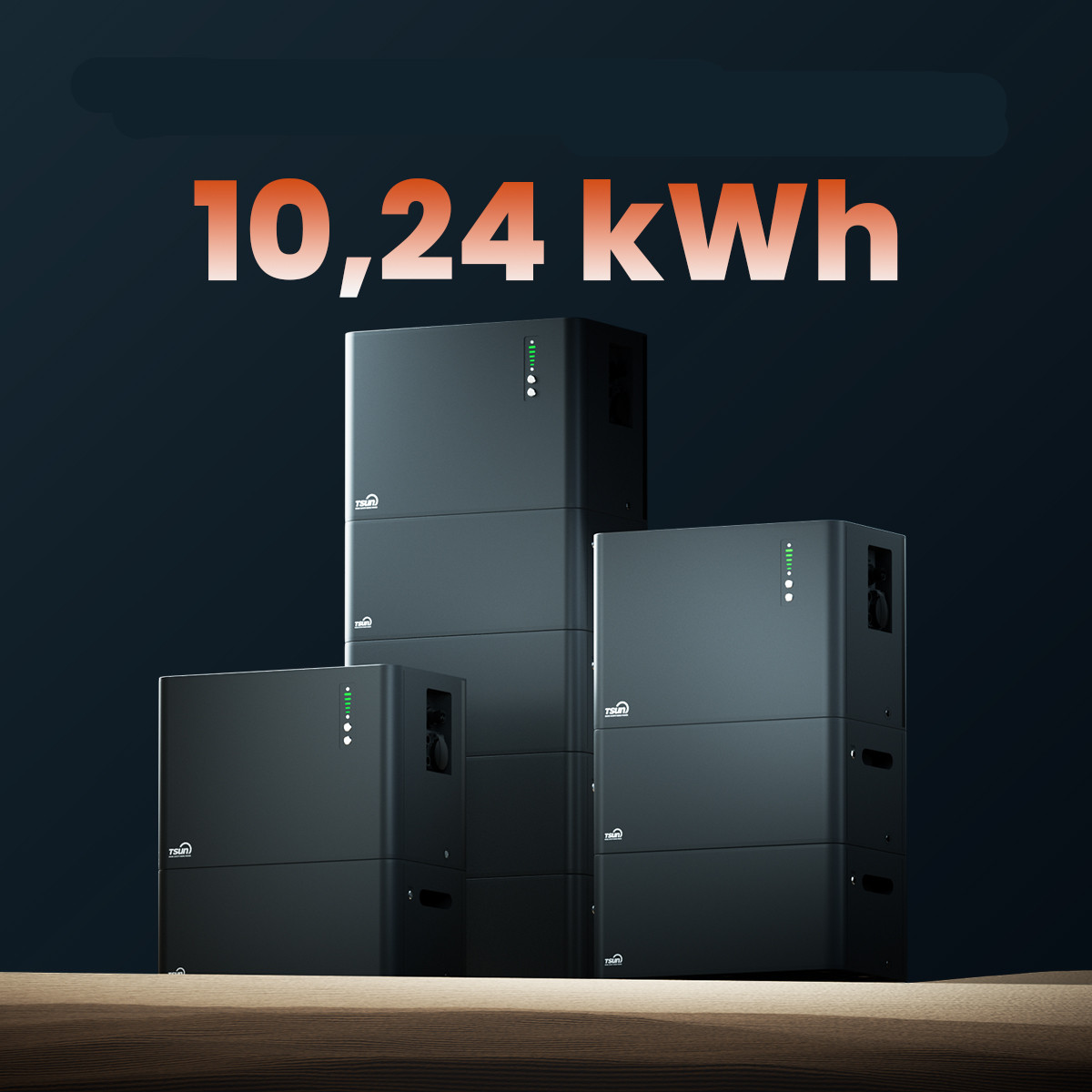 Three black energy storage units stacked on a wooden surface, labeled 10.24 kWh.
