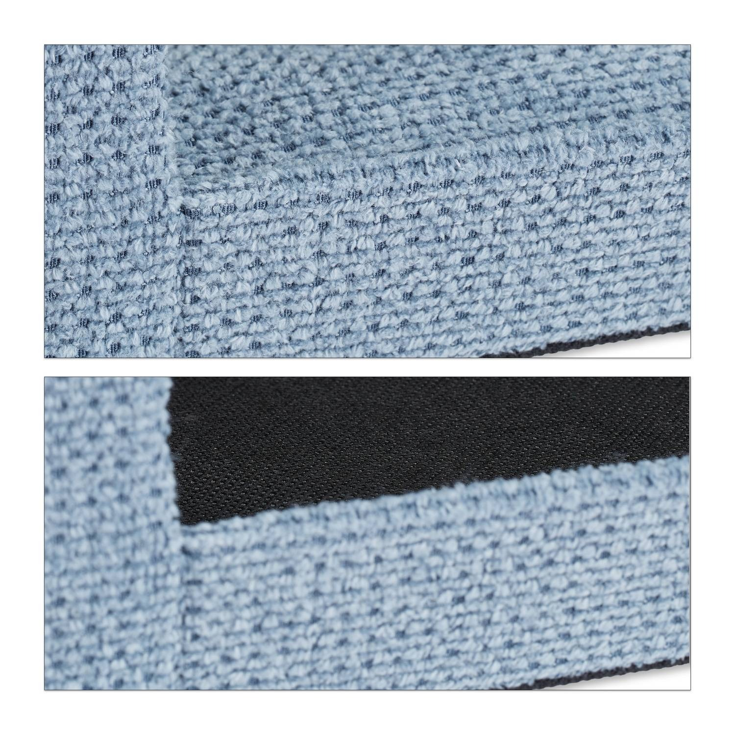 Textura de tela azul claro con un patrón fino. Se ve un área más oscura.
