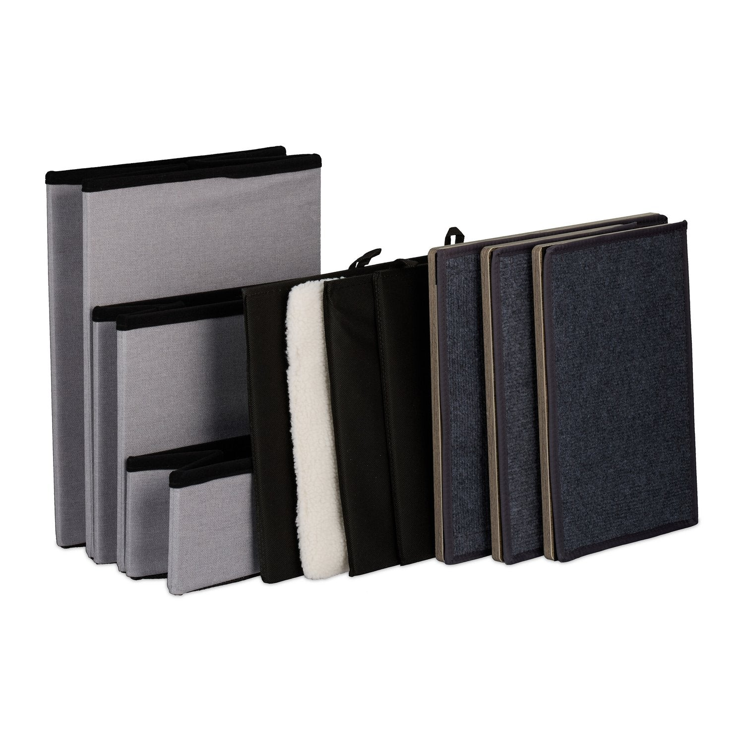 Varias cajas de almacenamiento en gris, negro y azul oscuro, algunas con forro de piel.