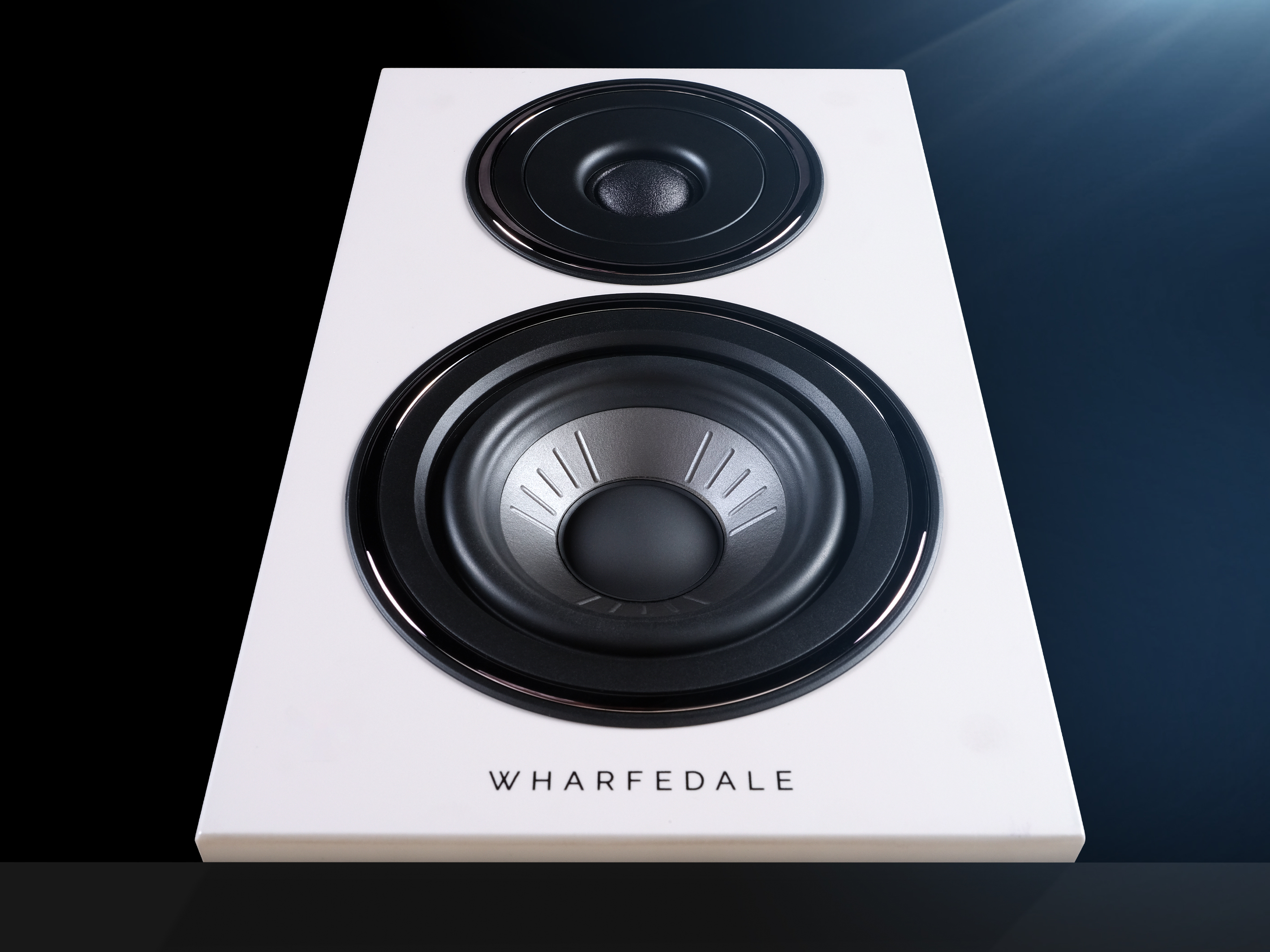 White speaker with two black drivers. Wharfedale logo at the bottom.