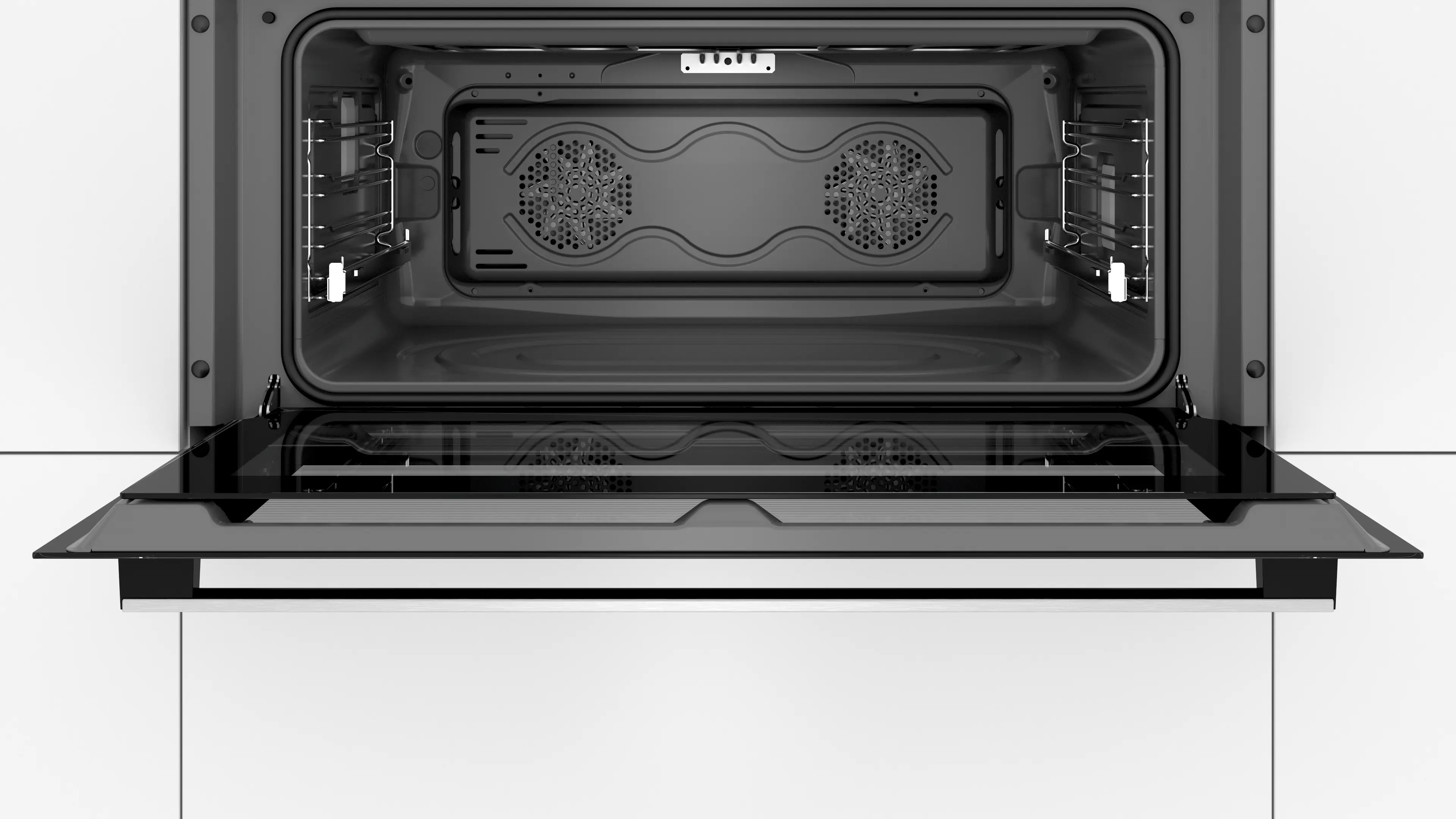 Intérieur d'un four moderne avec ventilateur et guides de grille.