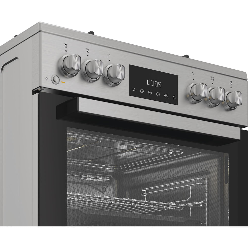 Forno in acciaio inox con porta aperta, timer e manopole di controllo.