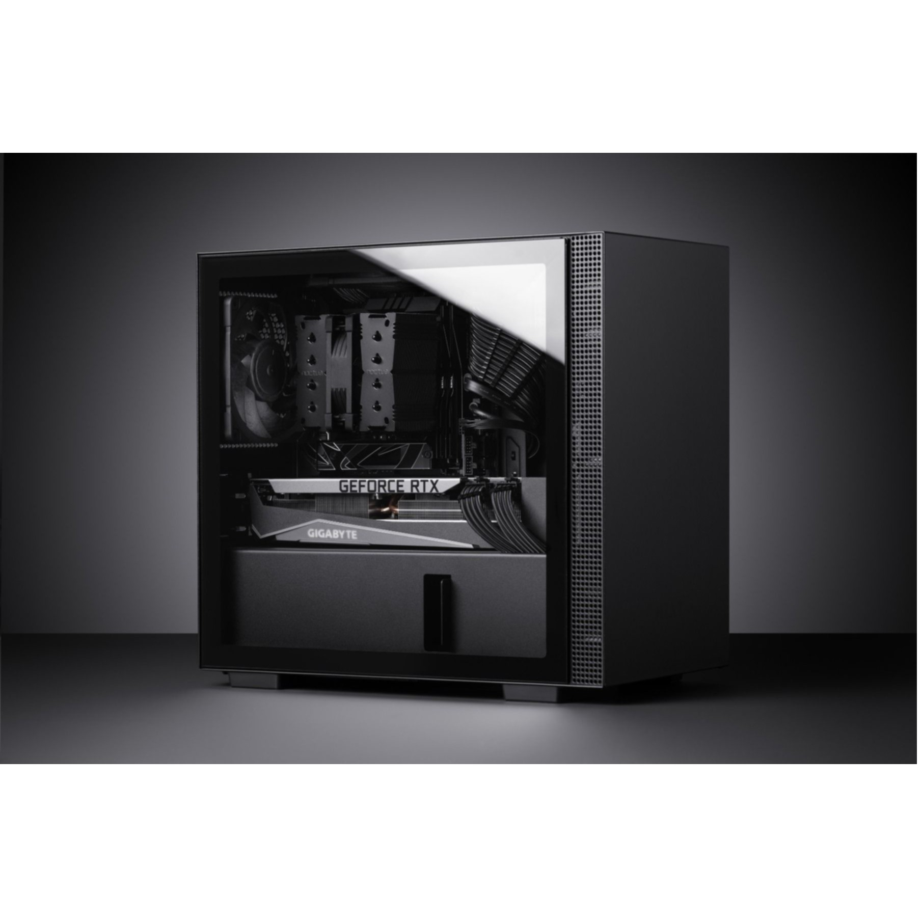A black PC tower with a glass window showing a graphics card.