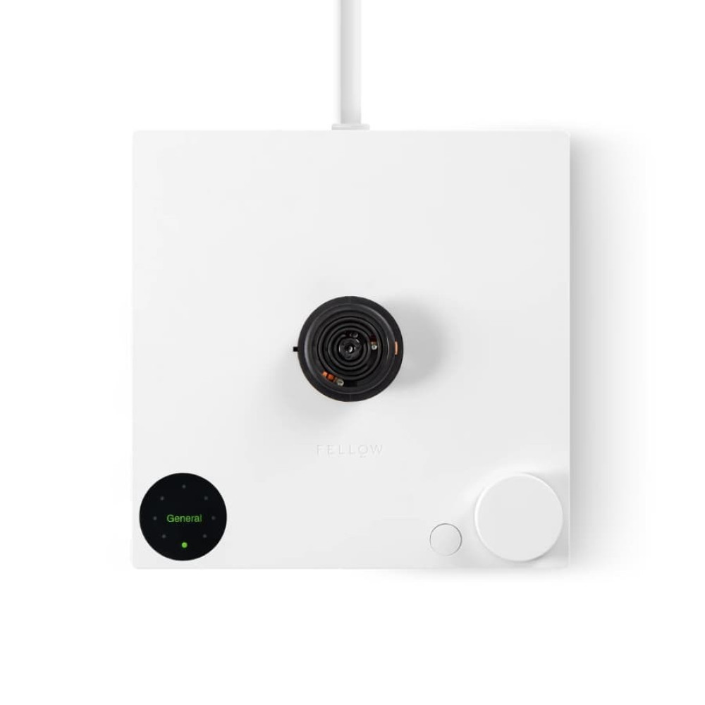 Biały czajnik z czarną cewką i okrągłym zielonym wyświetlaczem.