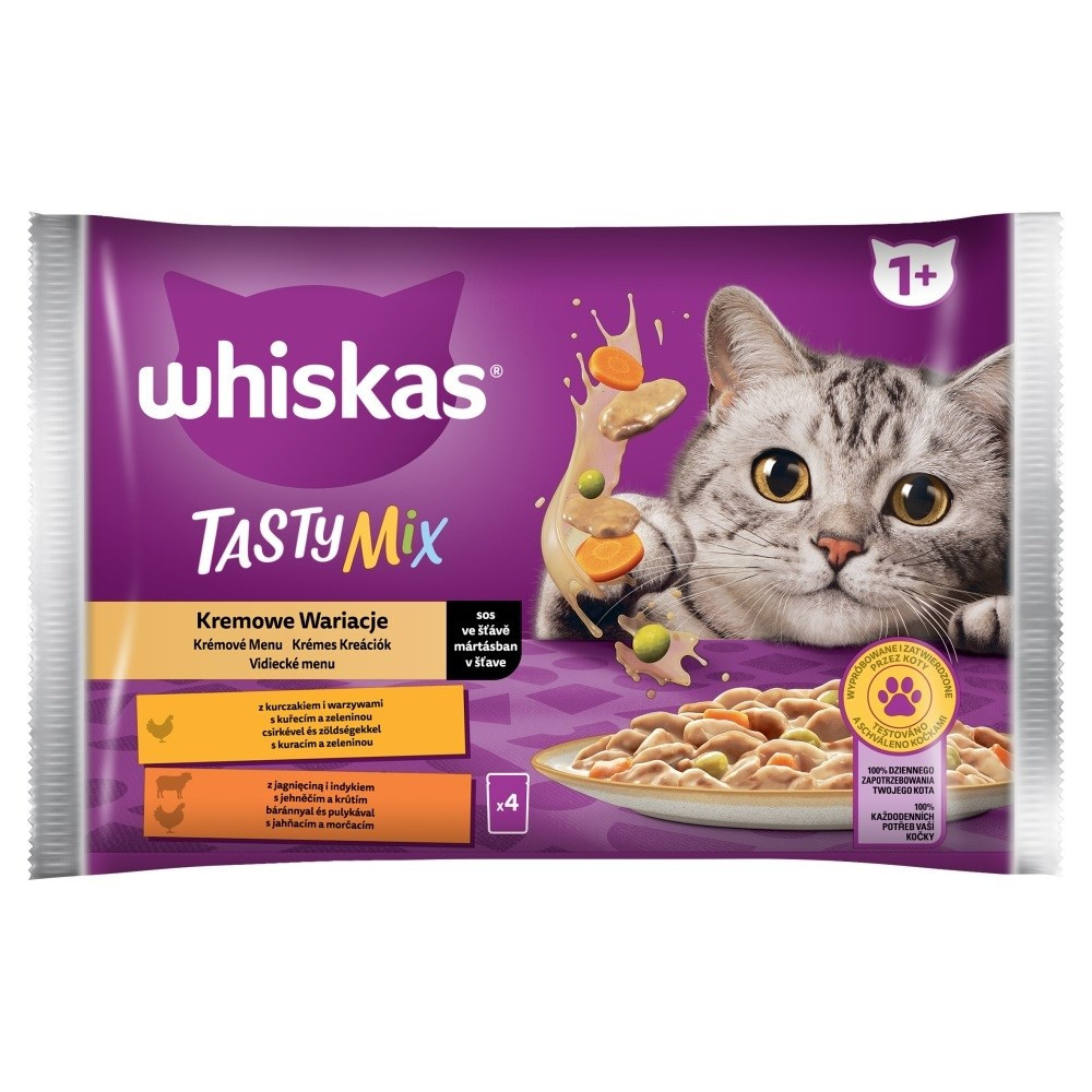 Comida para gatos Whiskas Tasty Mix con pollo, cordero y zanahorias. Gato mira el envase.