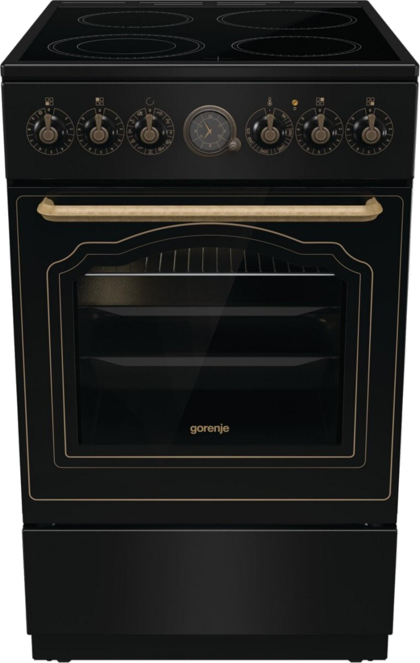 Una cucina nera con finiture dorate e finestra del forno.