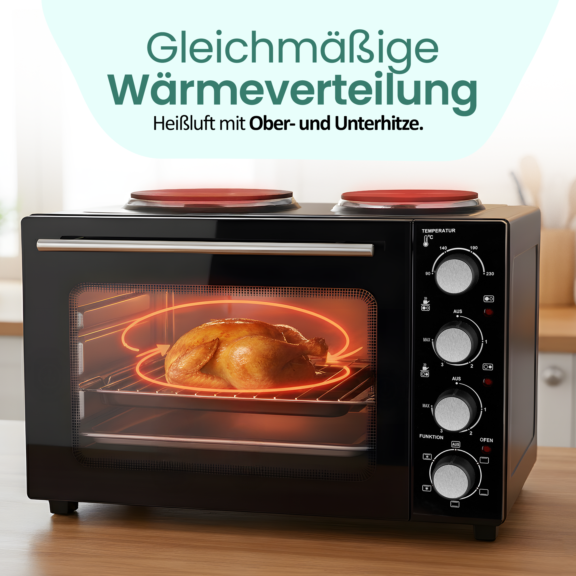 Ein schwarzer Ofen mit einem gebratenen Hähnchen im Inneren. Zwei Kochplatten oben.