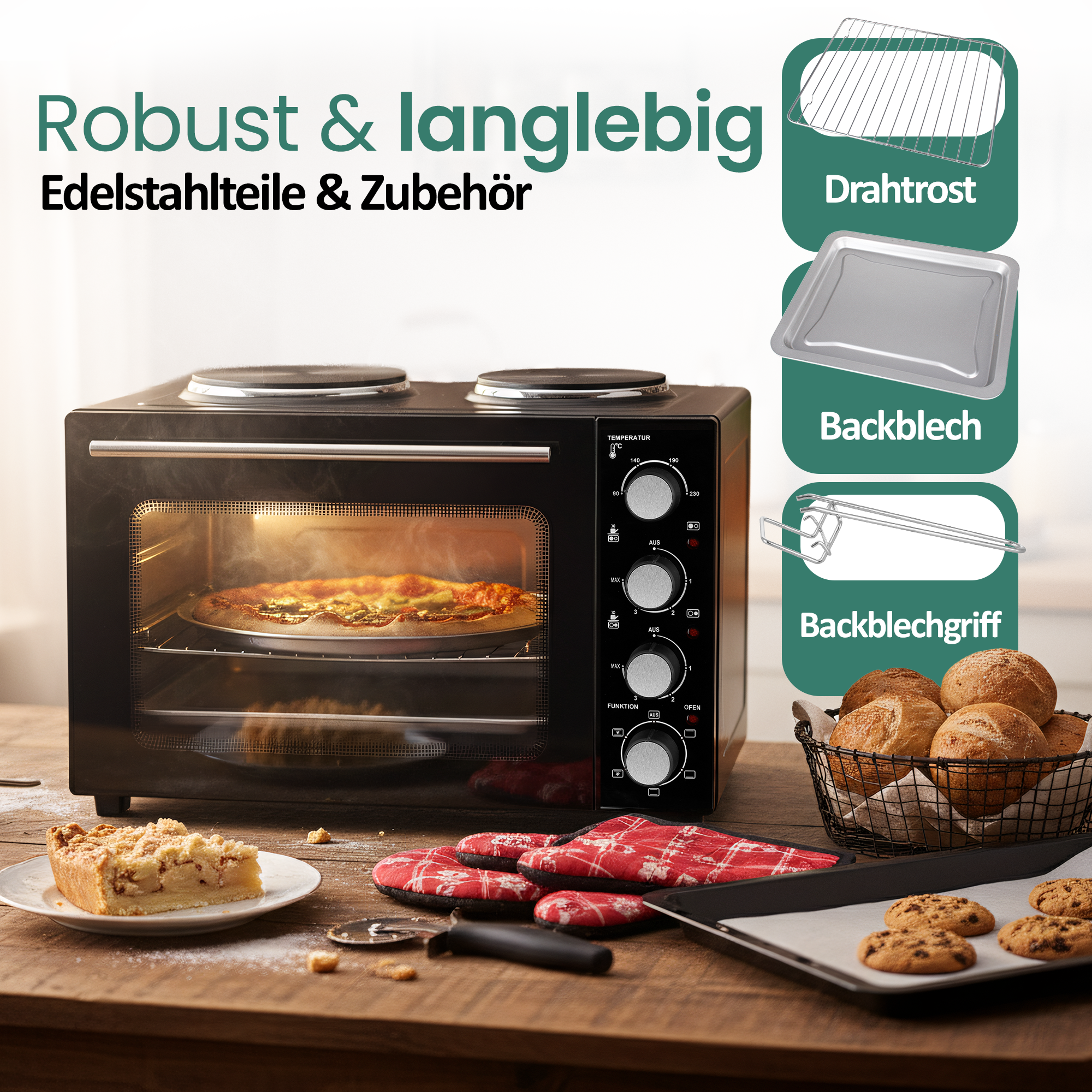 Ein schwarzer Minibackofen mit einem Pizza-Backblech, einem Kuchenstück und Gebäck.