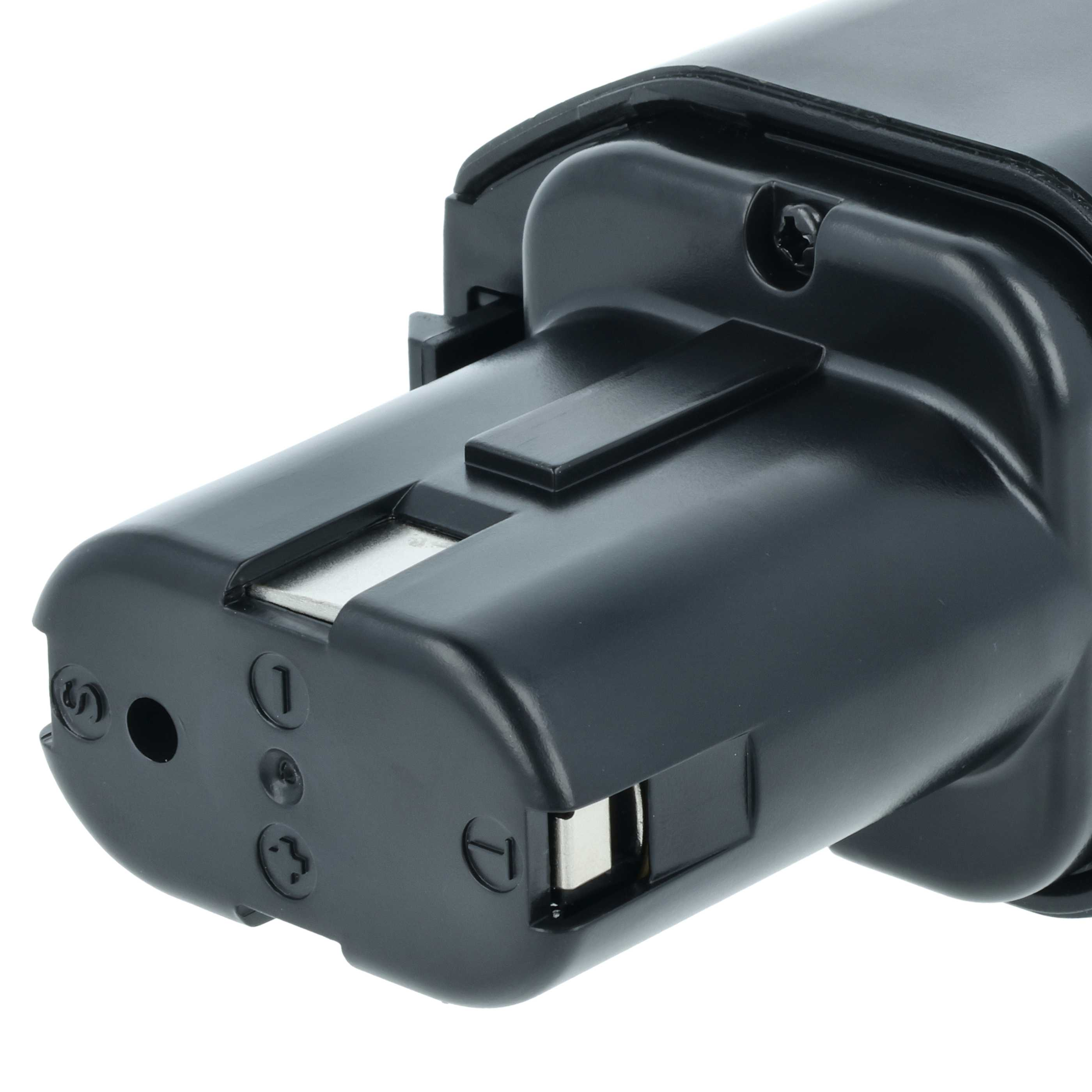 Nahaufnahme einer schwarzen Batterie mit Metallkontakten und Markierungen wie 1, 3 und S.