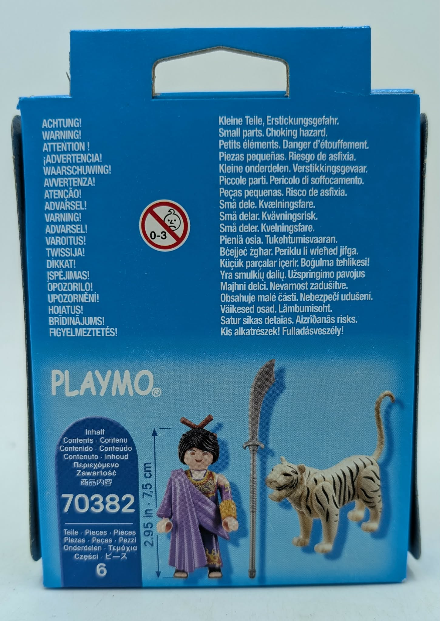 Playmobil box with figures and warnings. Includes a figure and a tiger.