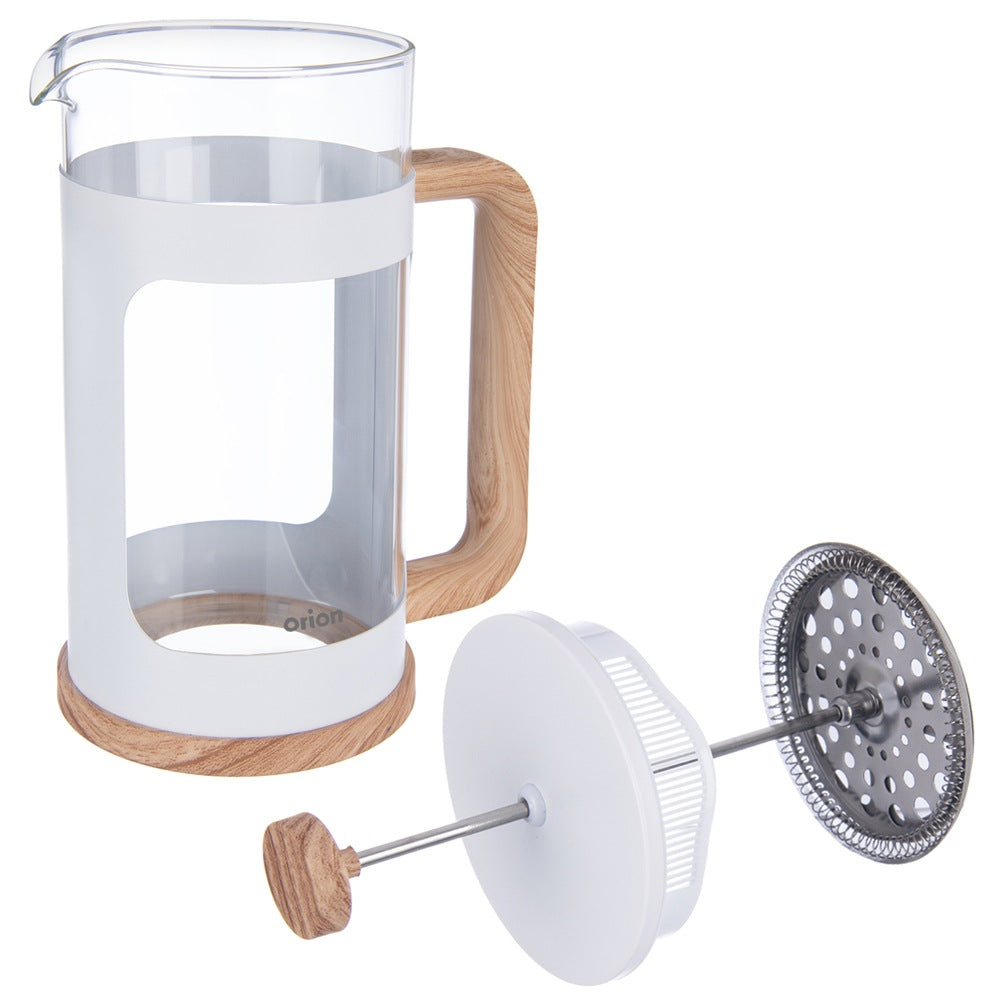 Una cafetera de émbolo de cristal con marco blanco y detalles de madera, junto a su émbolo.
