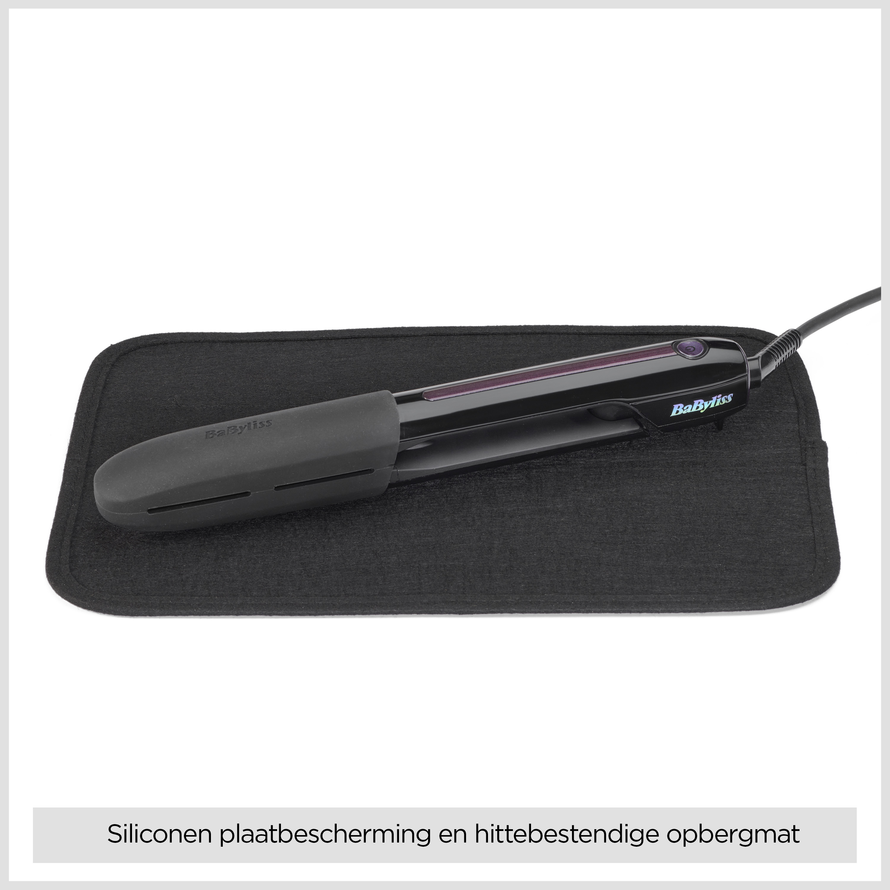 A black heat-resistant storage mat with a BaByliss hair straightener on top.