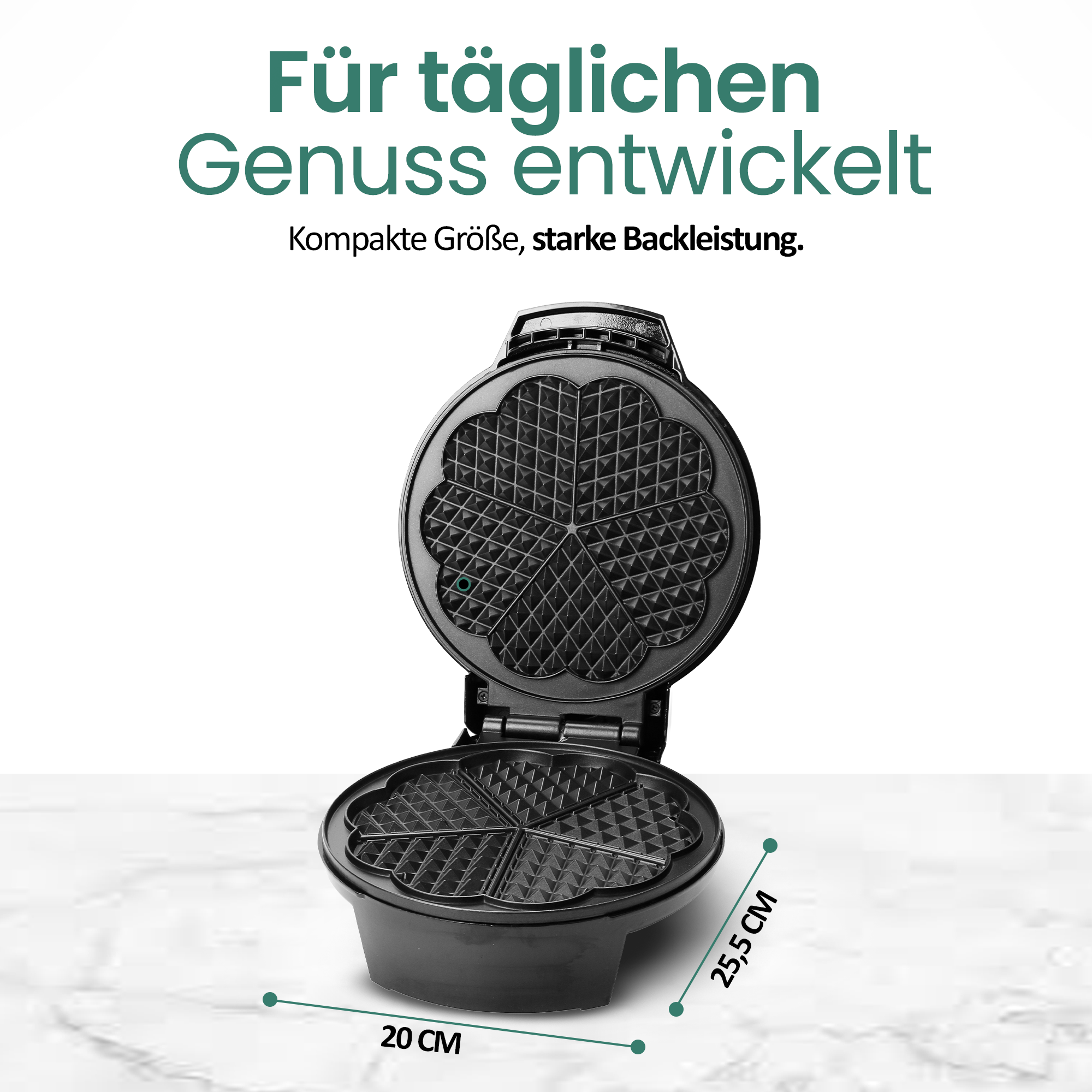 Ein offenes schwarzes Waffeleisen mit Herzform-Vertiefungen.