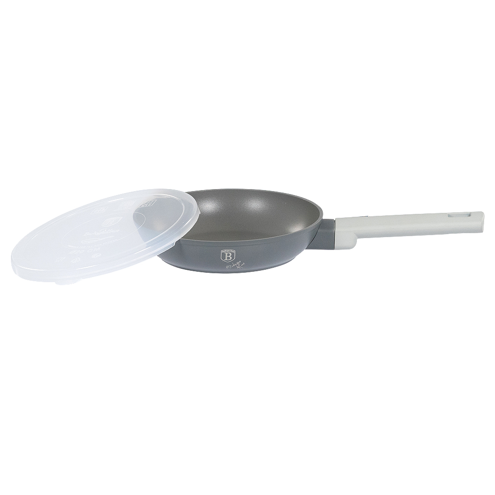 Graue Pfanne mit weißem Griff und durchsichtigem Deckel.