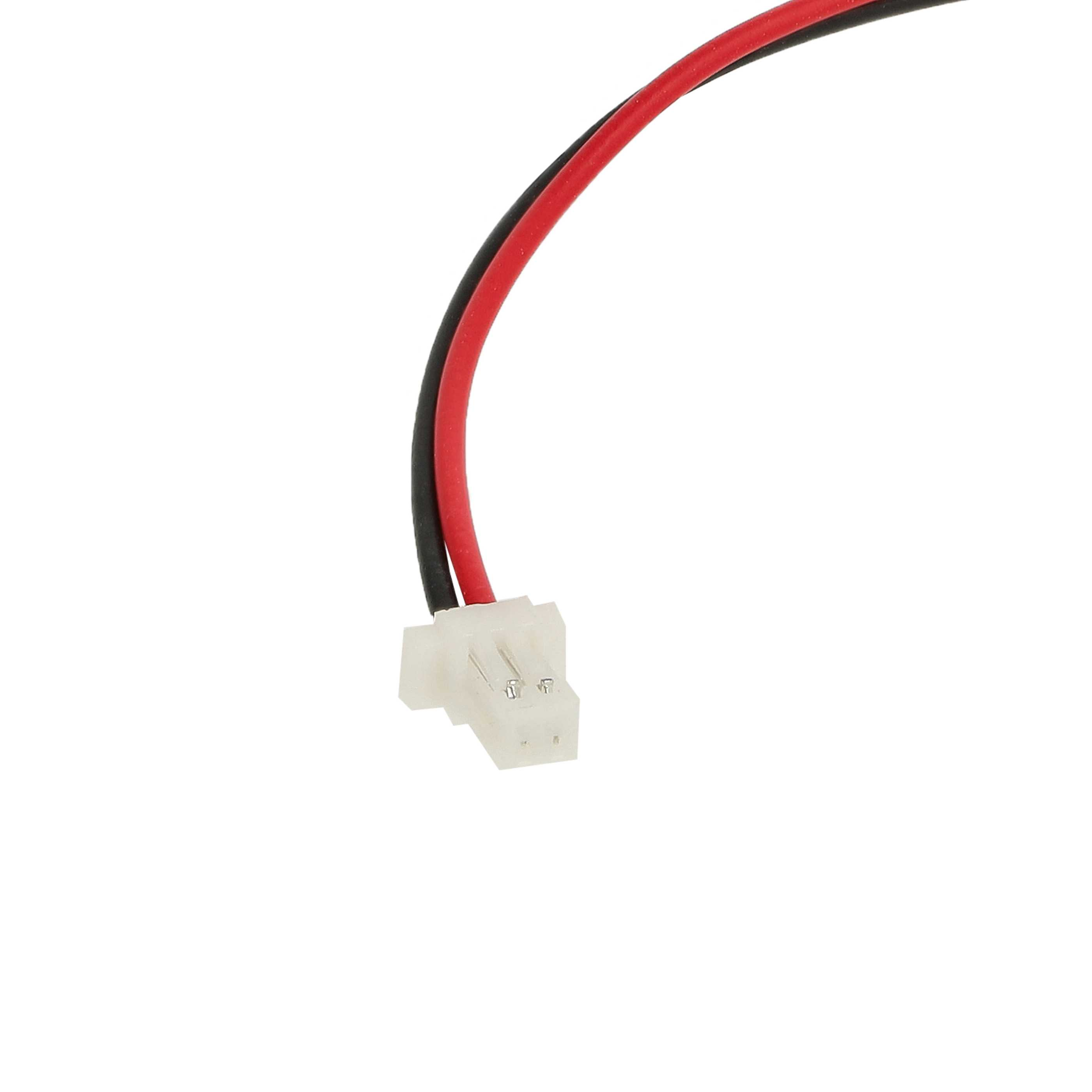 Ein weißer Stecker mit roten und schwarzen Kabeln.