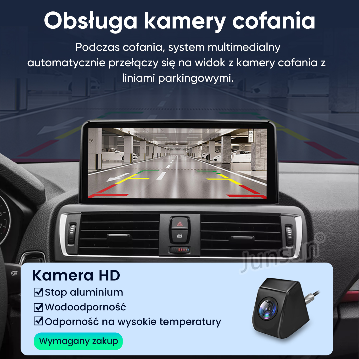 Wnętrze samochodu z ekranem kamery cofania pokazującym parking.