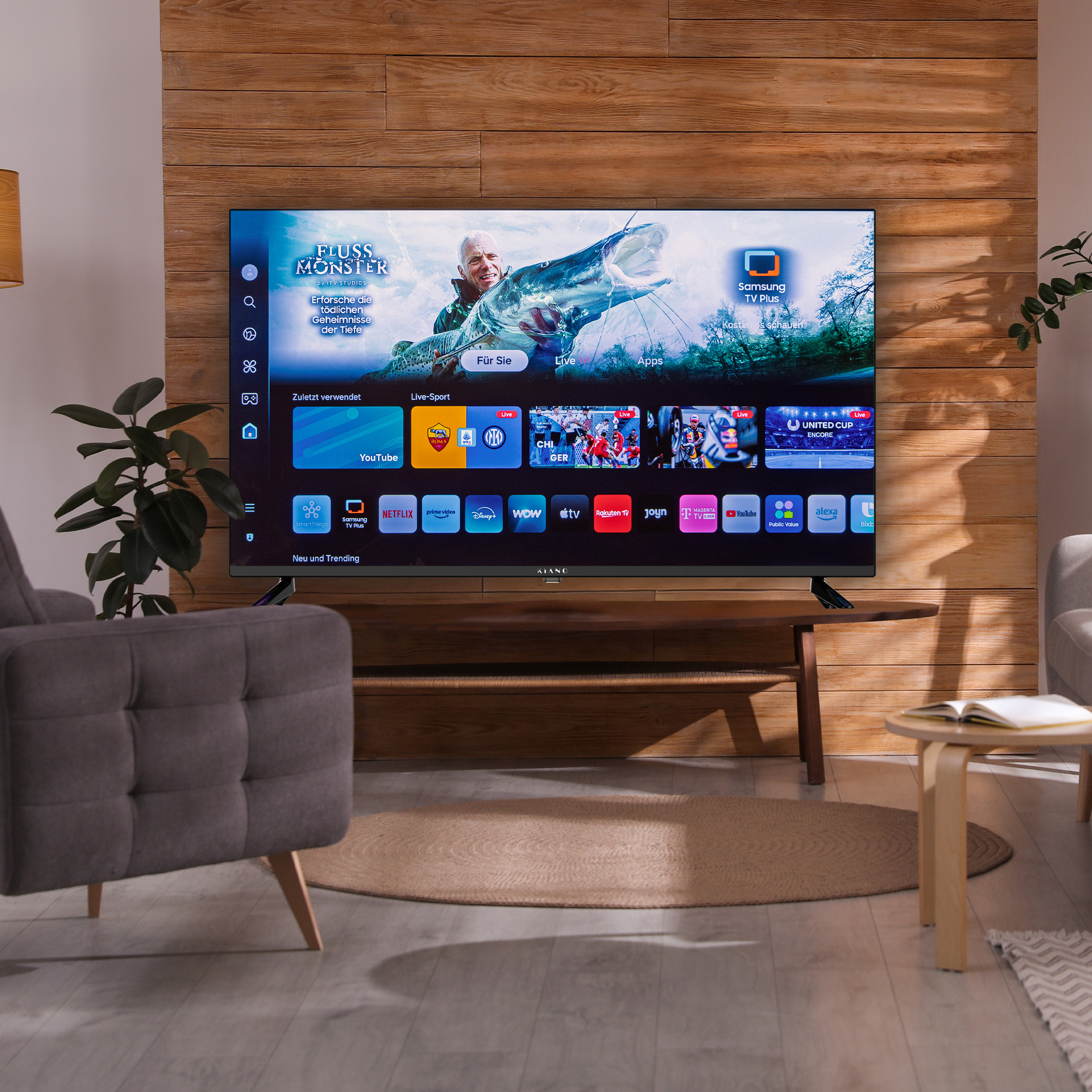 Ein moderner Wohnbereich mit einem Smart-TV, der ein Angela-Programm zeigt.