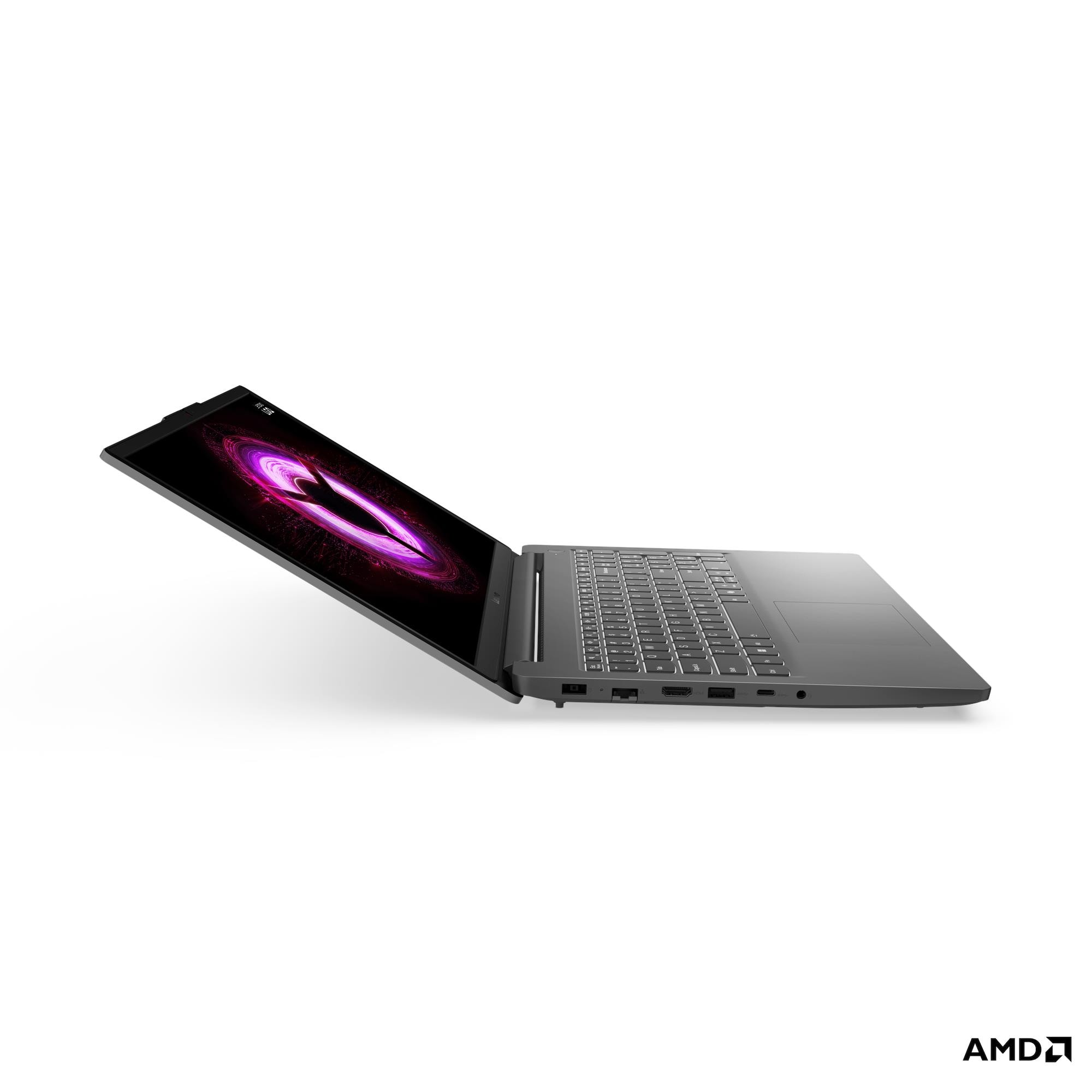 Un laptop grigio aperto che mostra un motivo viola vorticoso sul suo schermo.