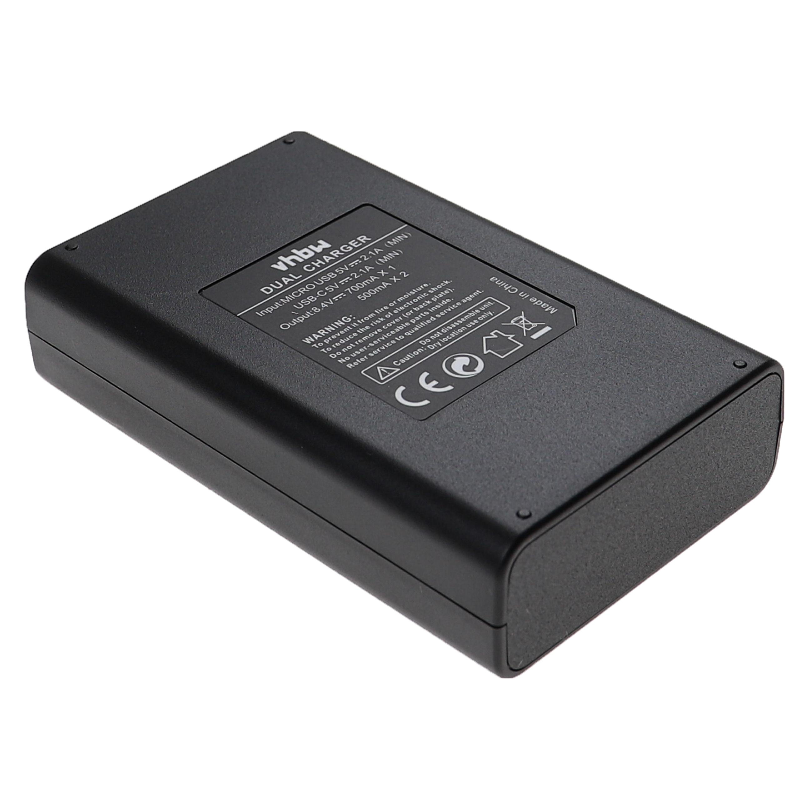 Schwarzes Ladegerät mit Beschriftung: Dual Charger, Input/Output-Spezifikationen.