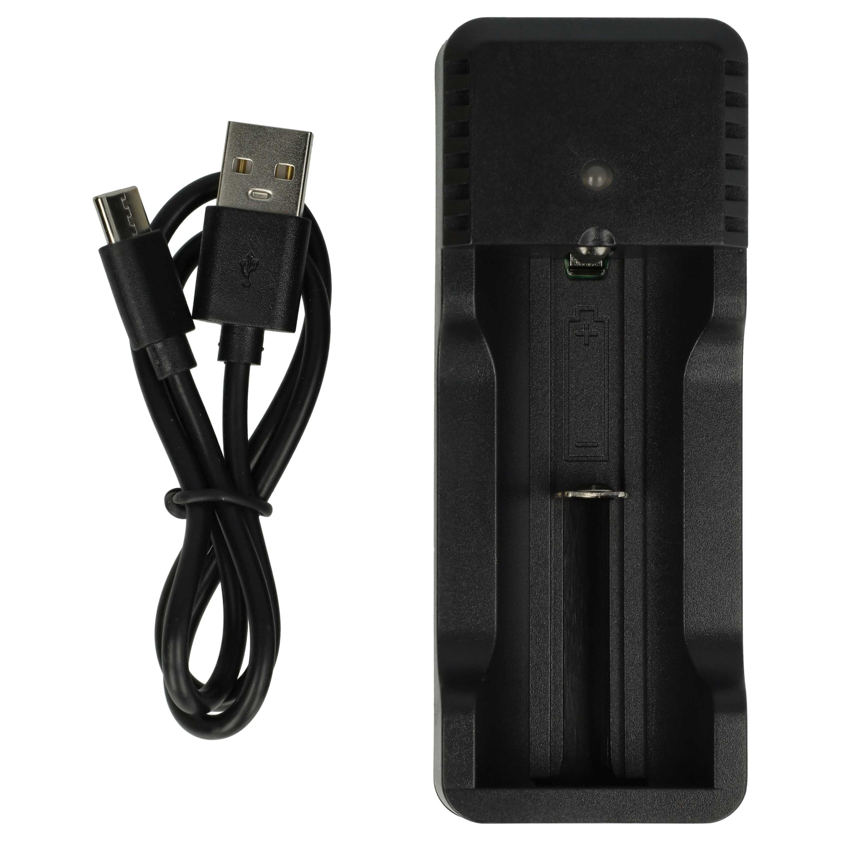 Ein schwarzes USB-Kabel liegt neben einem schwarzen Batterieladegerät.