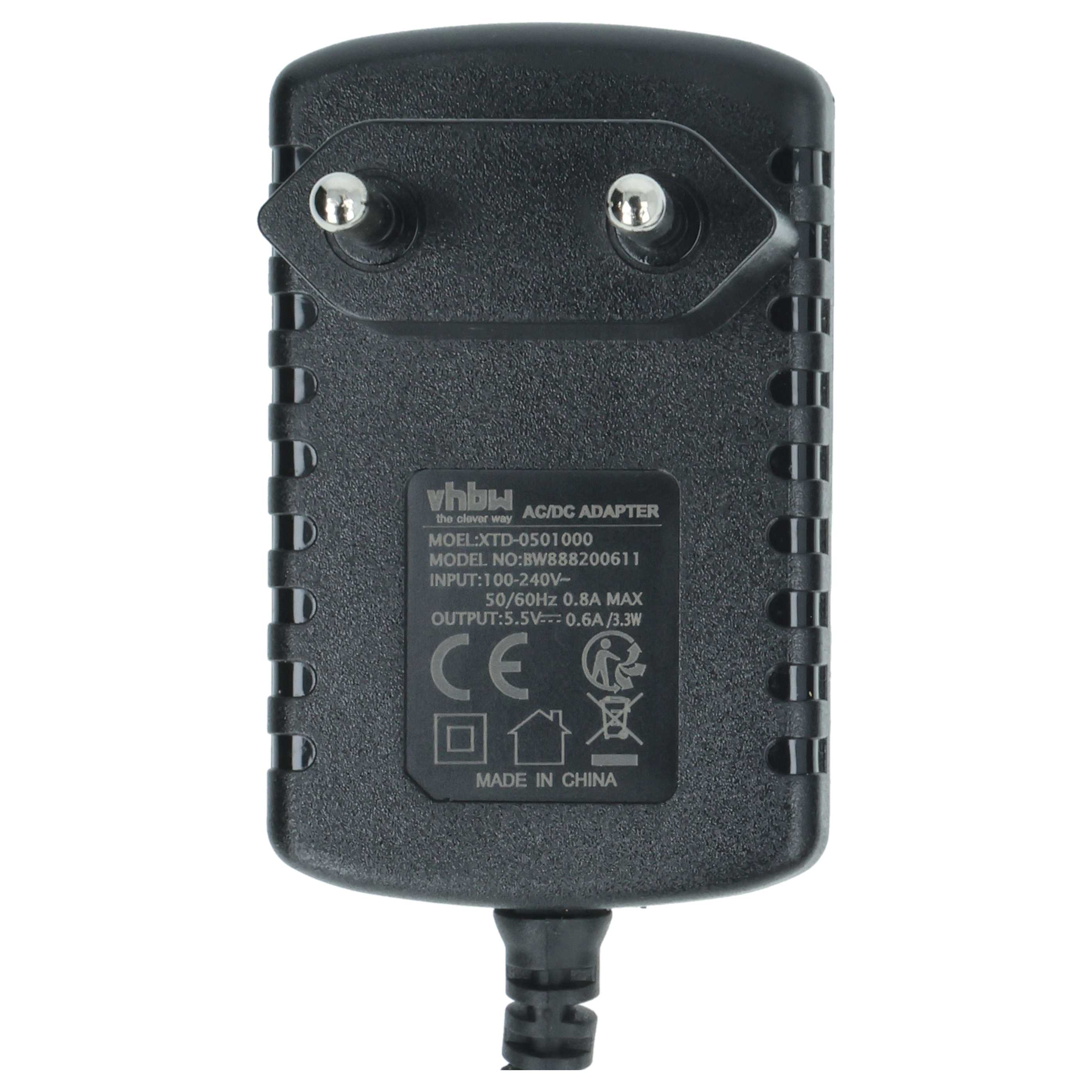 Schwarzer AC/DC-Adapter mit zwei Metallstiften und Hinweissymbolen.