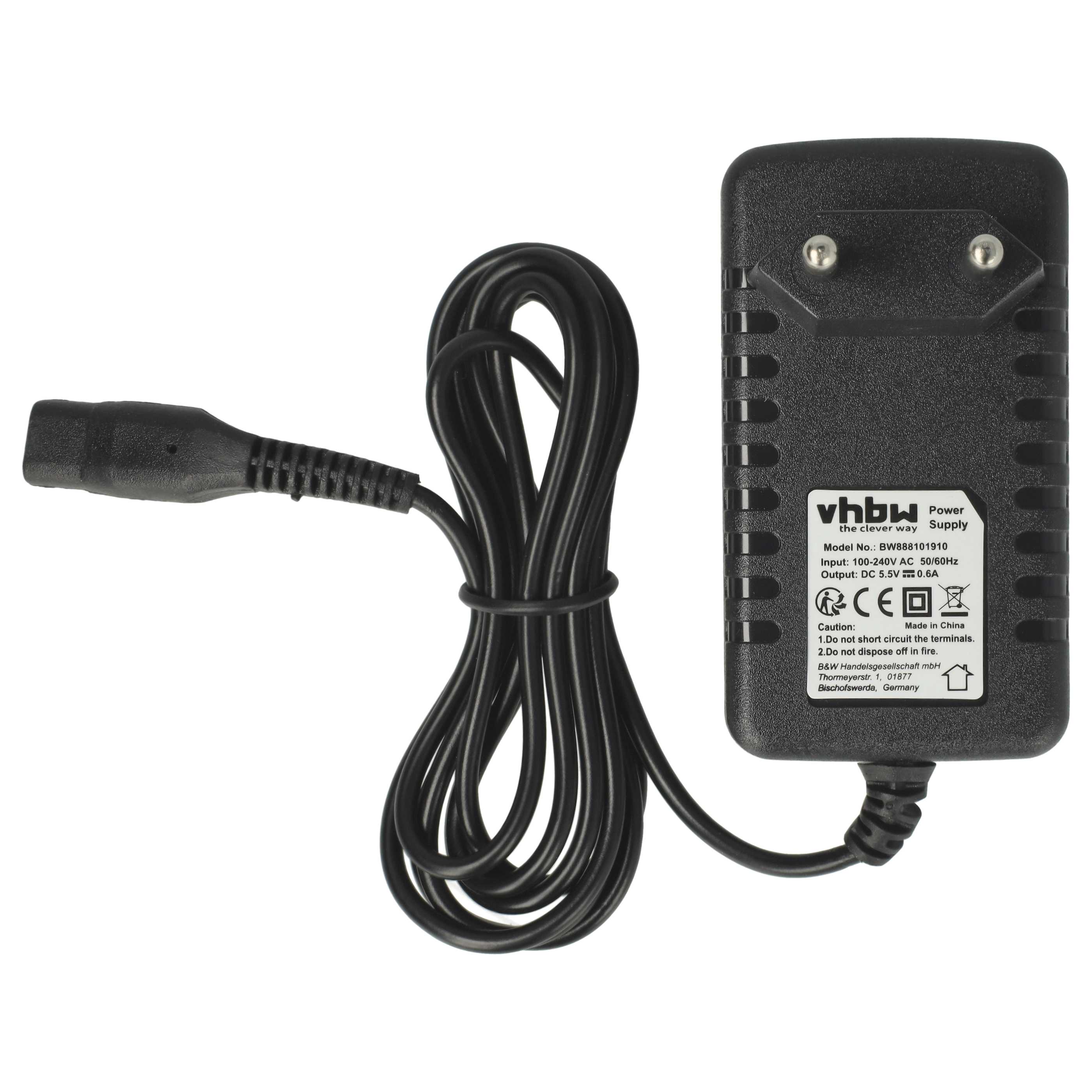 Schwarzes Netzteil mit Kabel und Stecker. Beschriftung sichtbar.