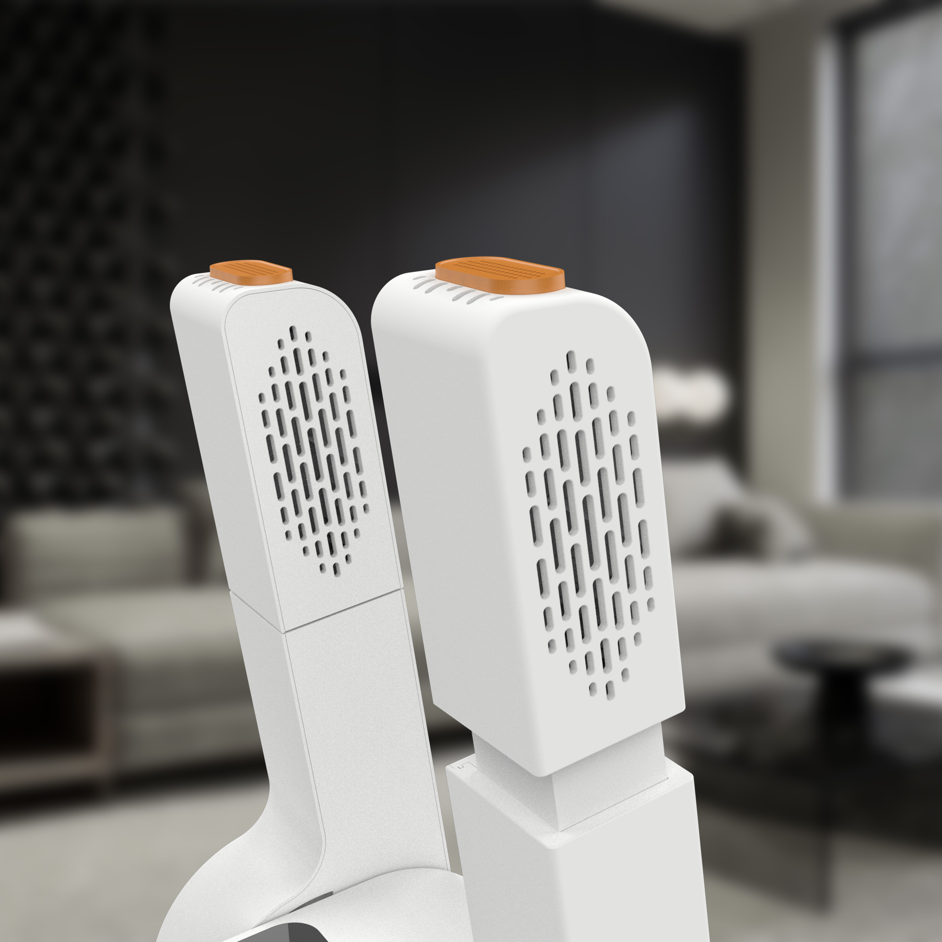 Two white devices with orange tops stand in front of a blurred living room.