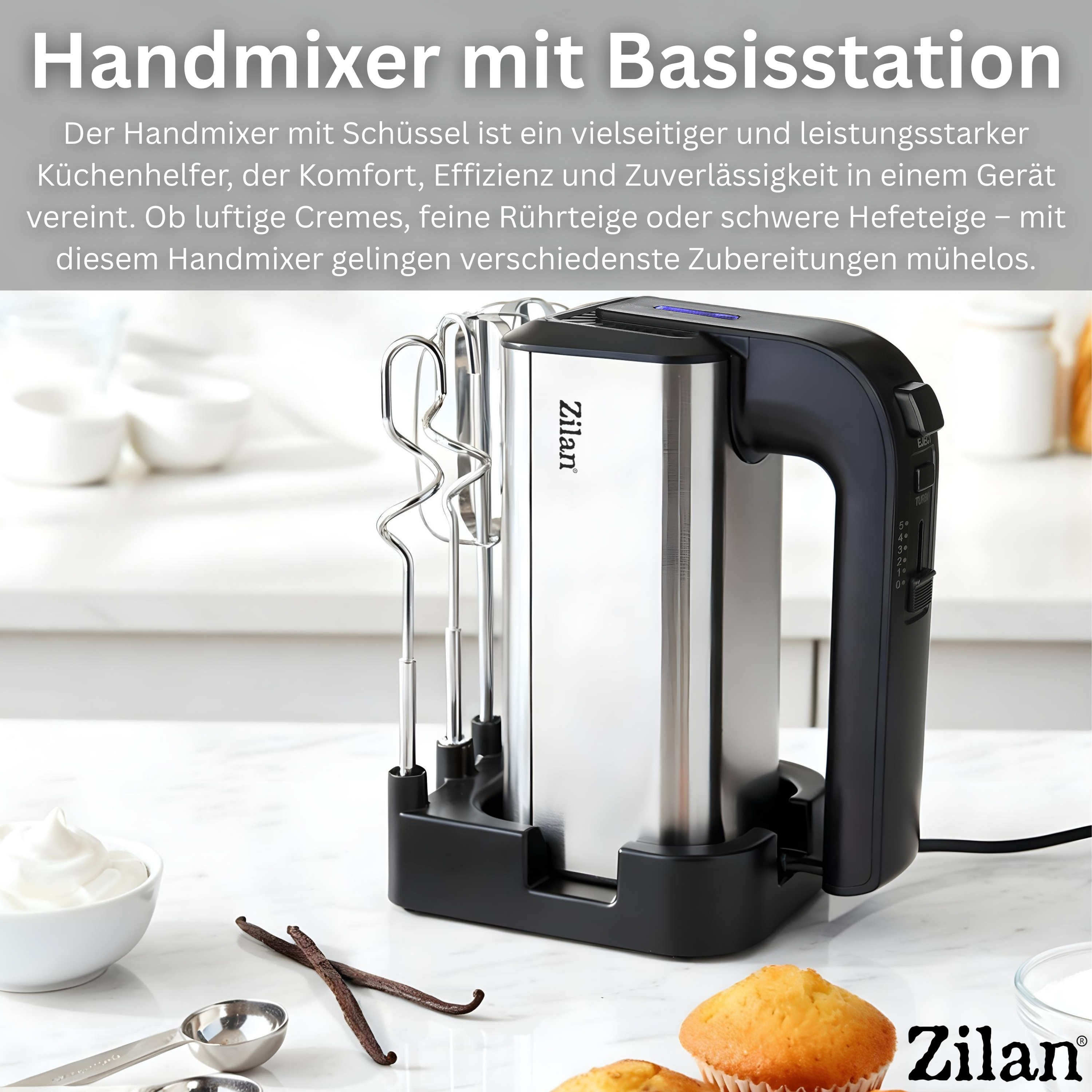 Ein silberner Handmixer mit schwarzem Griff steht auf einer Marmorarbeitsplatte neben Schüsseln.