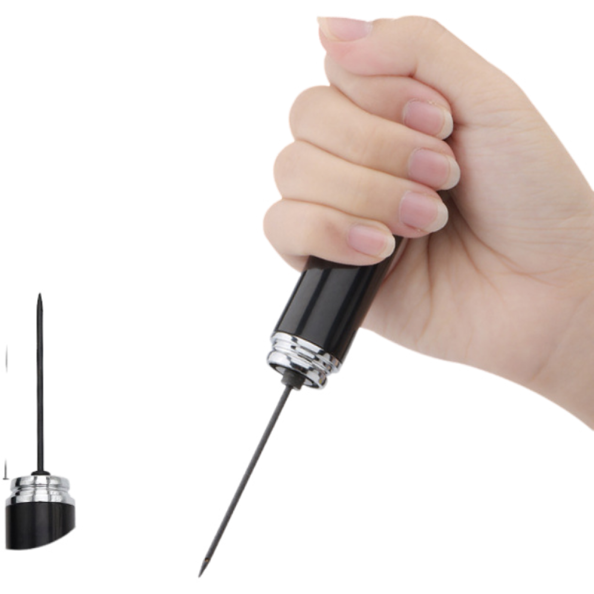 Eine Hand hält einen schwarzen Stift mit einer Nadel.