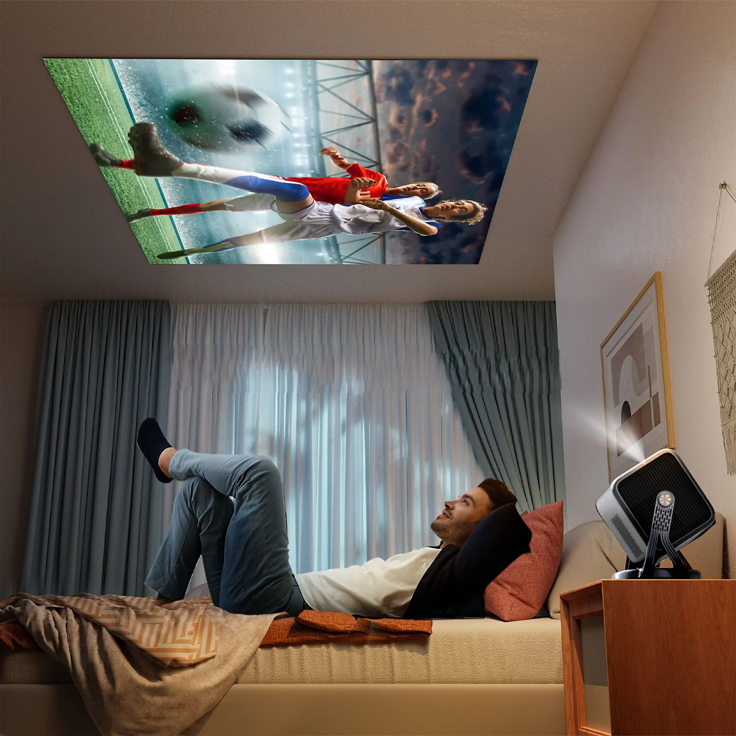 Man lies on a bed watching soccer projected onto the ceiling.
