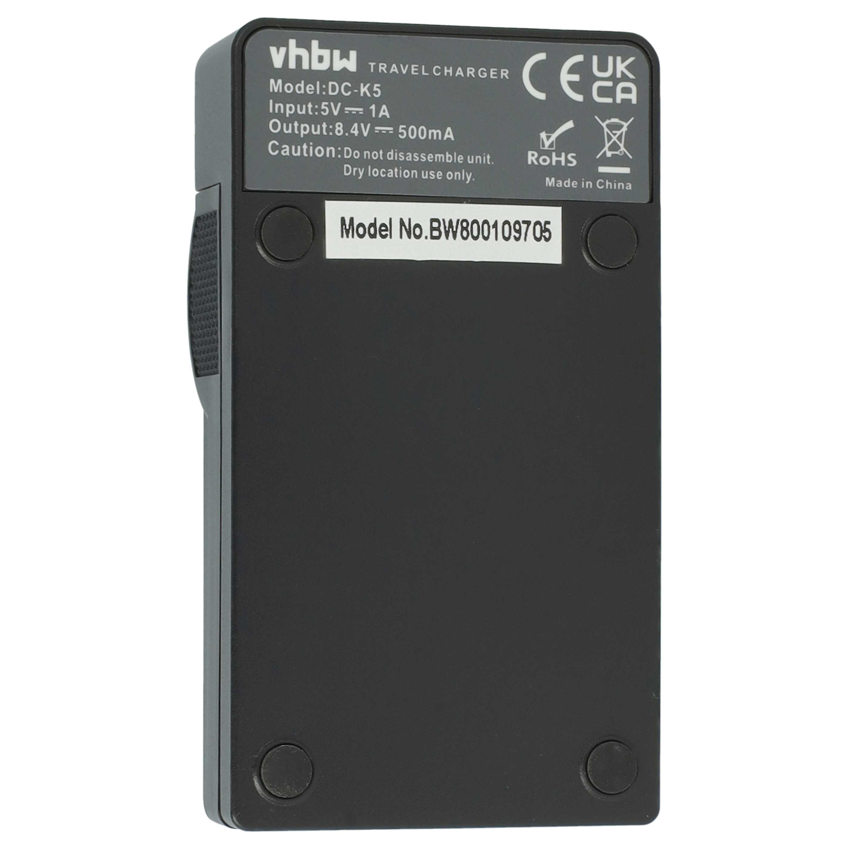 Schwarzes Ladegerät mit Beschriftung: Modell DC-K5, Eingabe 5V/1A, Ausgabe 8.4V/500mA.