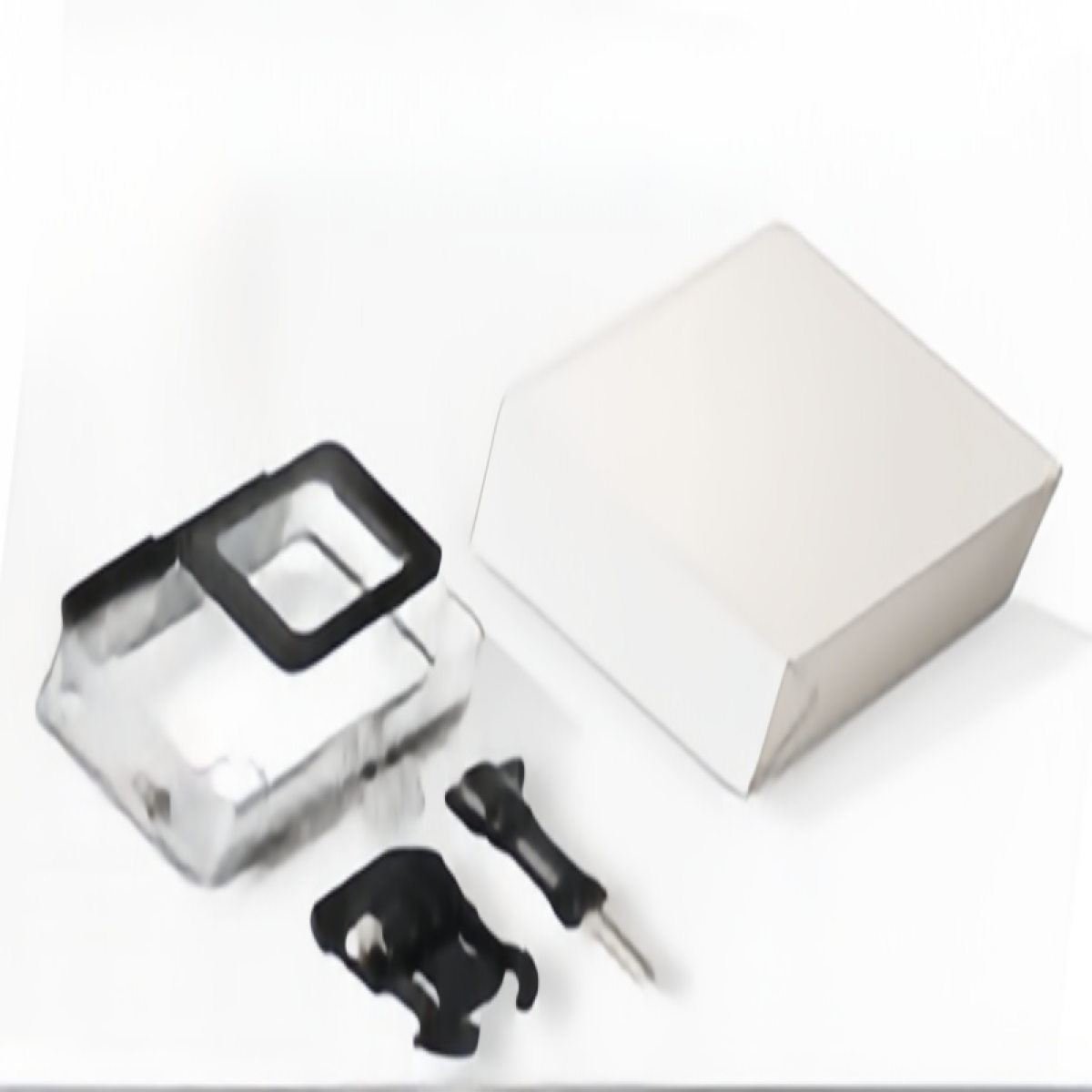 A clear plastic case with black frame, two black mounts, and a white box.