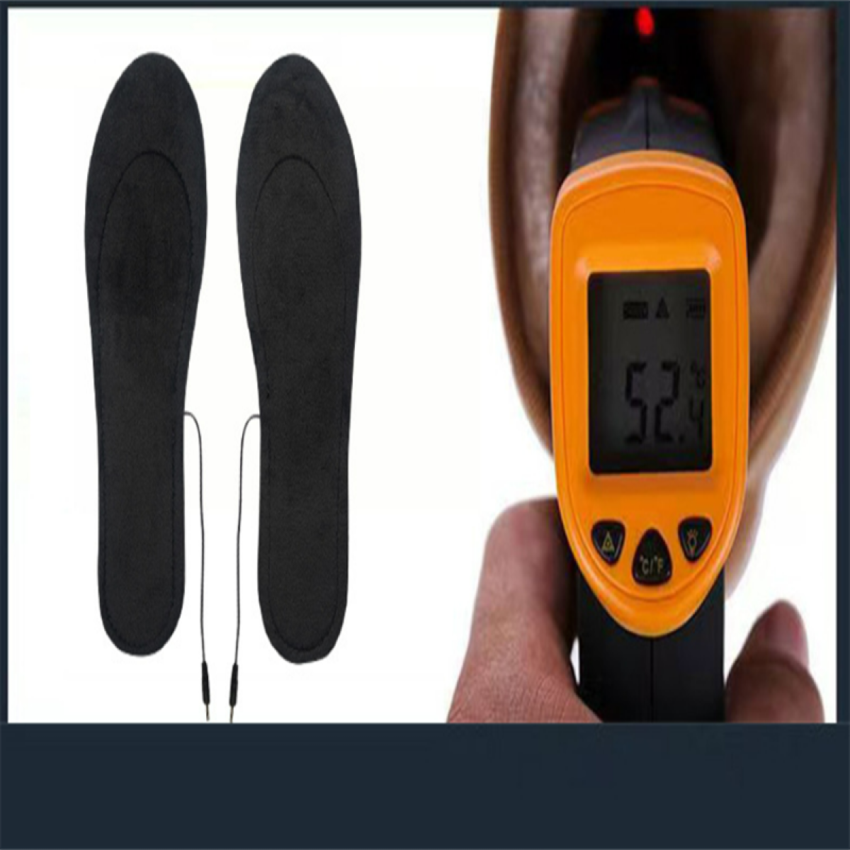 Dwie czarne wkładki z przewodami i termometr na podczerwień wskazujący 52,4 stopnia.