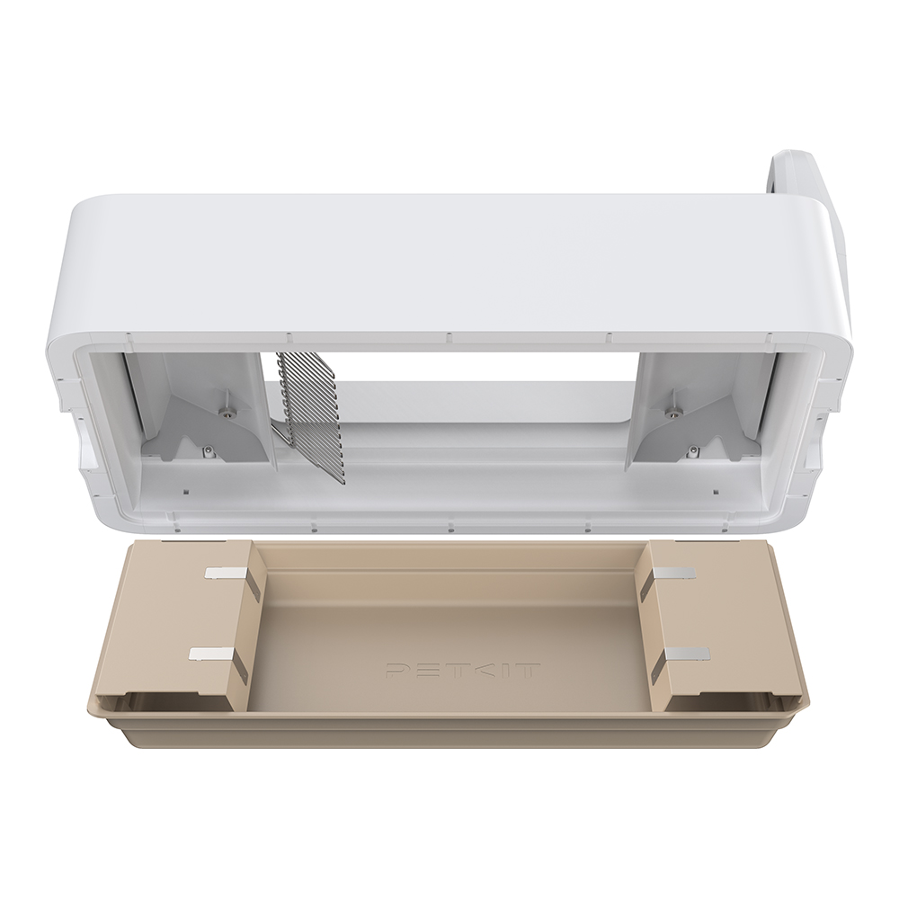 Ein zerlegter weißer und beige Haustierklo mit Gitter.