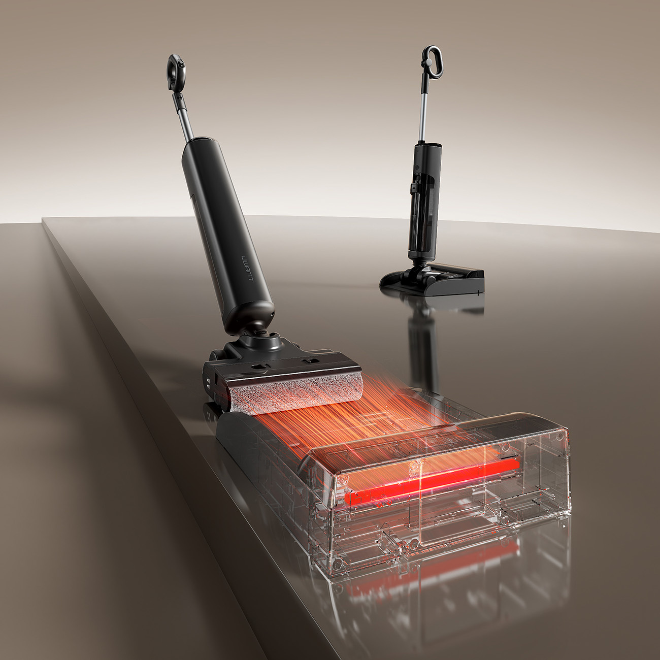 Dwa czarne odkurzacze na gładkiej powierzchni, jeden ze świecącymi pomarańczowymi włóknami.