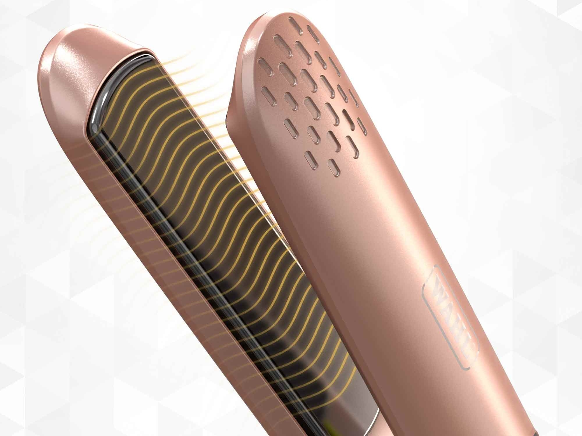 Plancha de pelo oro rosa con elementos calefactores ondulados y ranuras de ventilación.