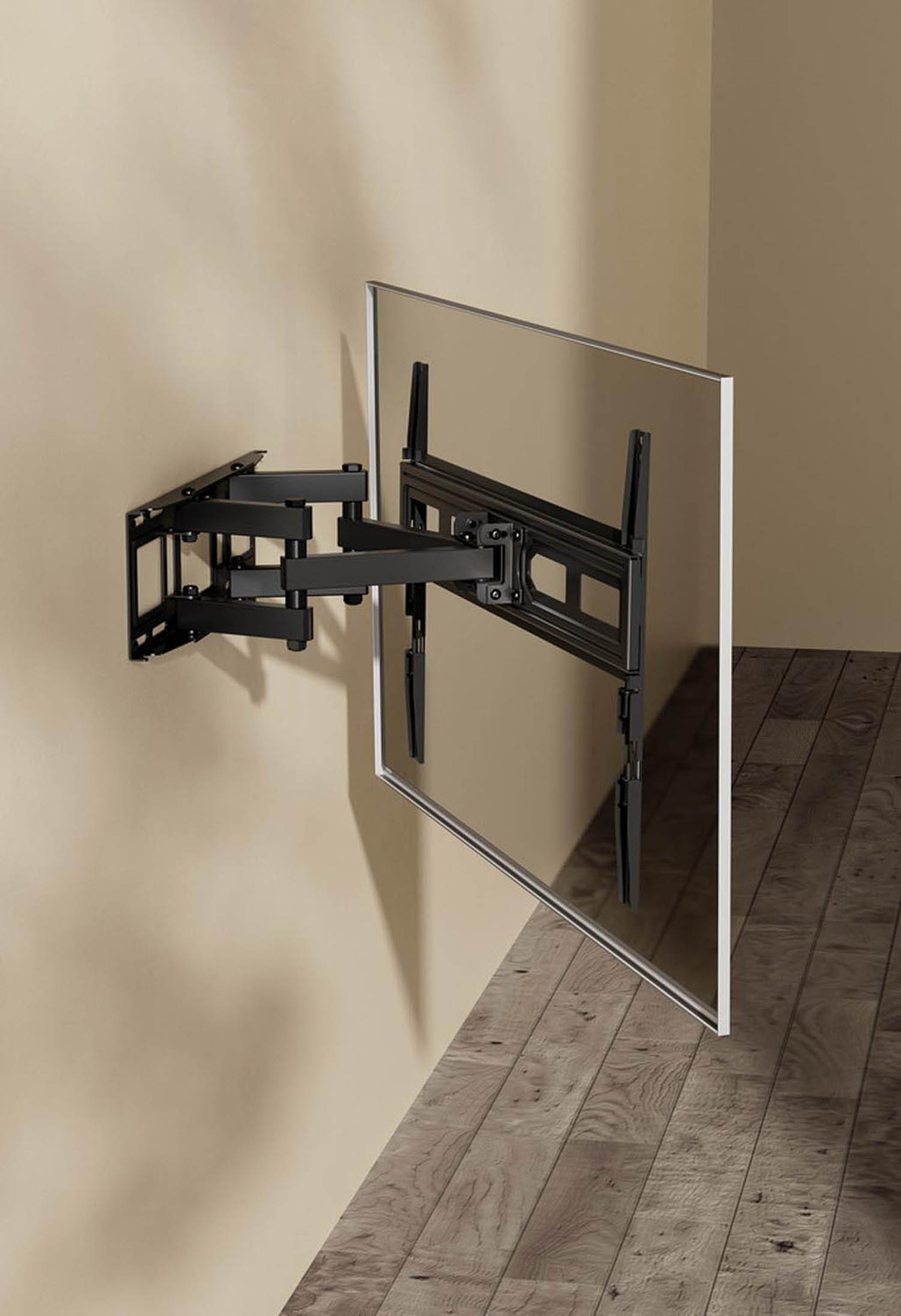 A black TV wall mount with an adjustable arm is attached to a cream-colored wall.