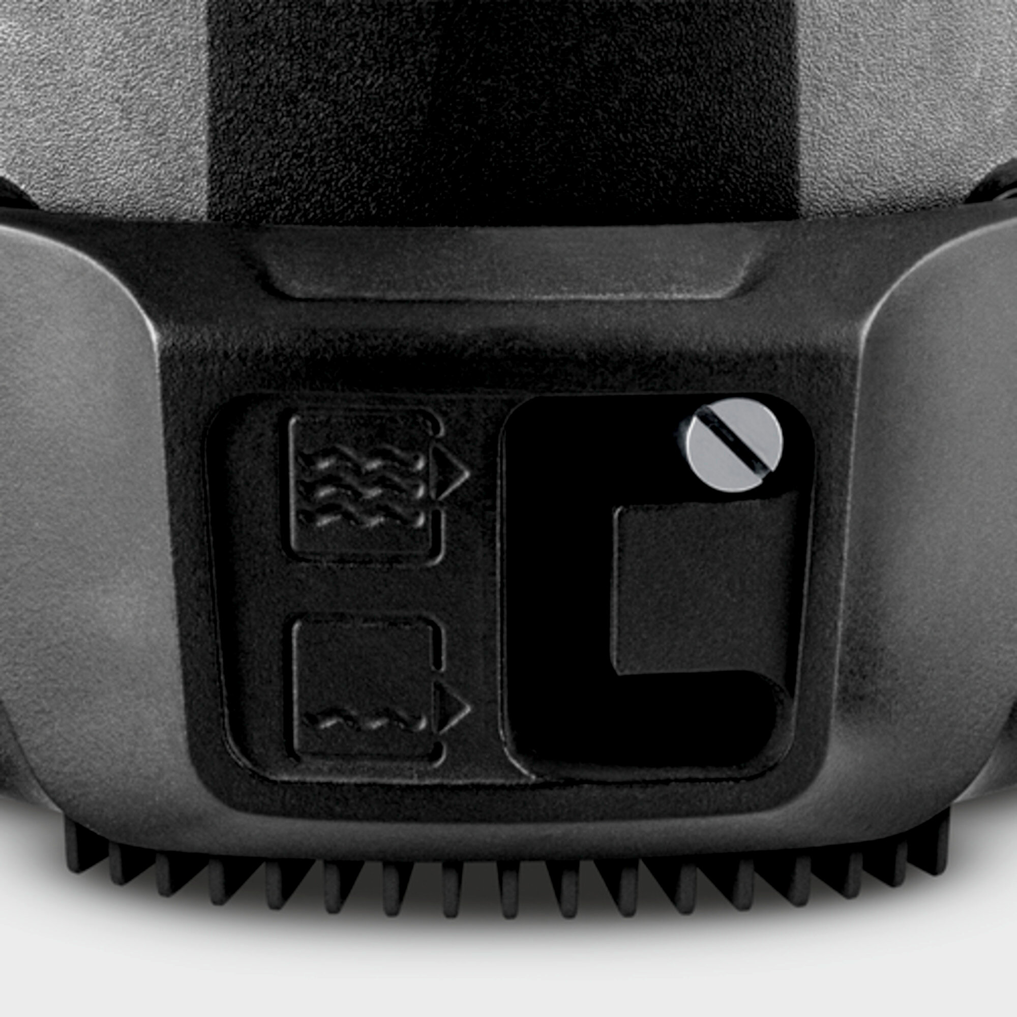 Zbliżenie czarnego urządzenia z ikonami fal i kwadratów.