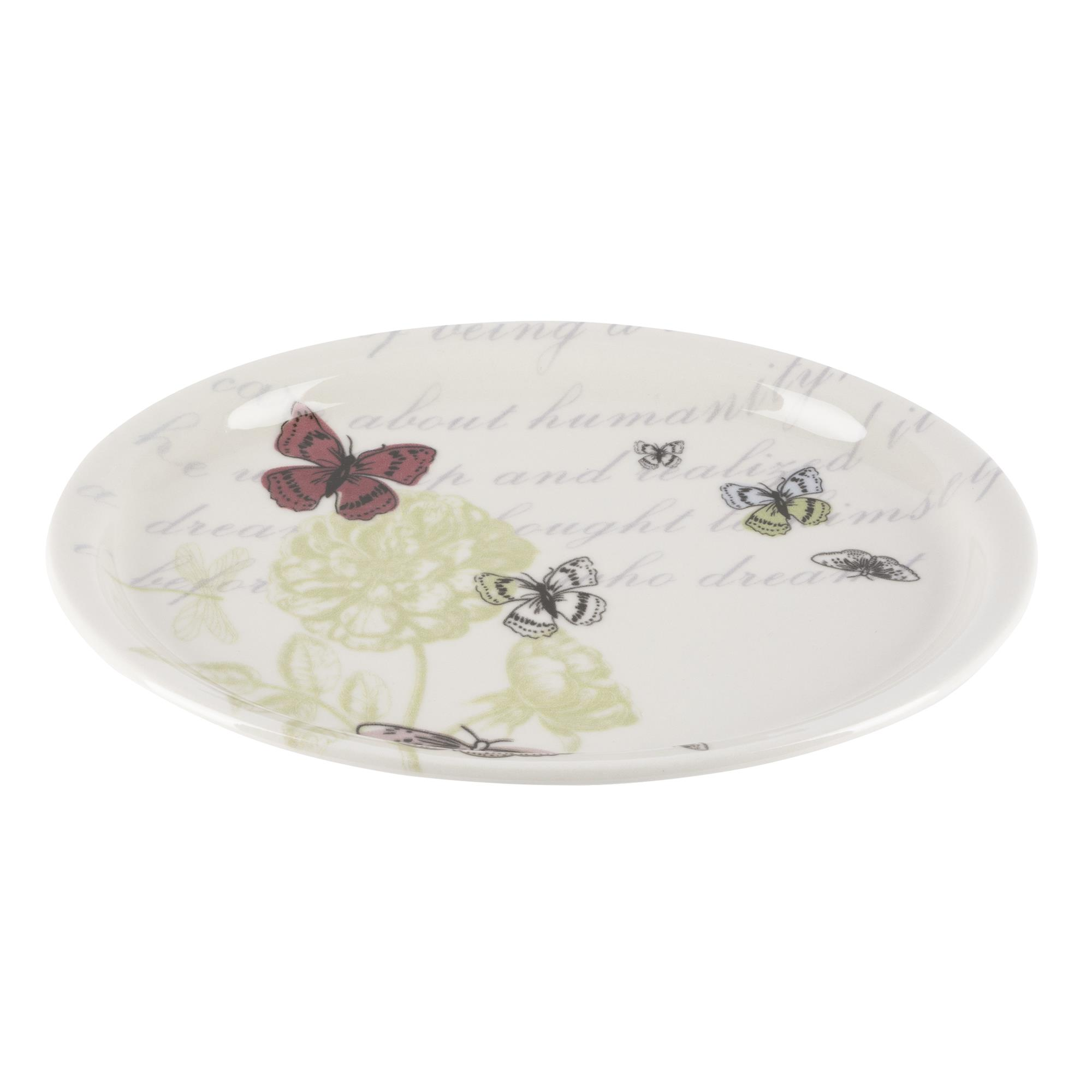 Un plato con mariposas y estampado floral.