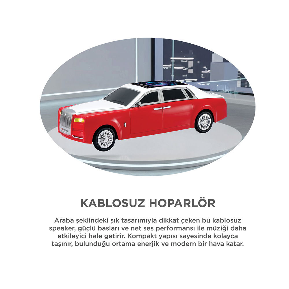 Kırmızı ve beyaz, araba şeklinde hoparlör, şehir manzaralı platformda.